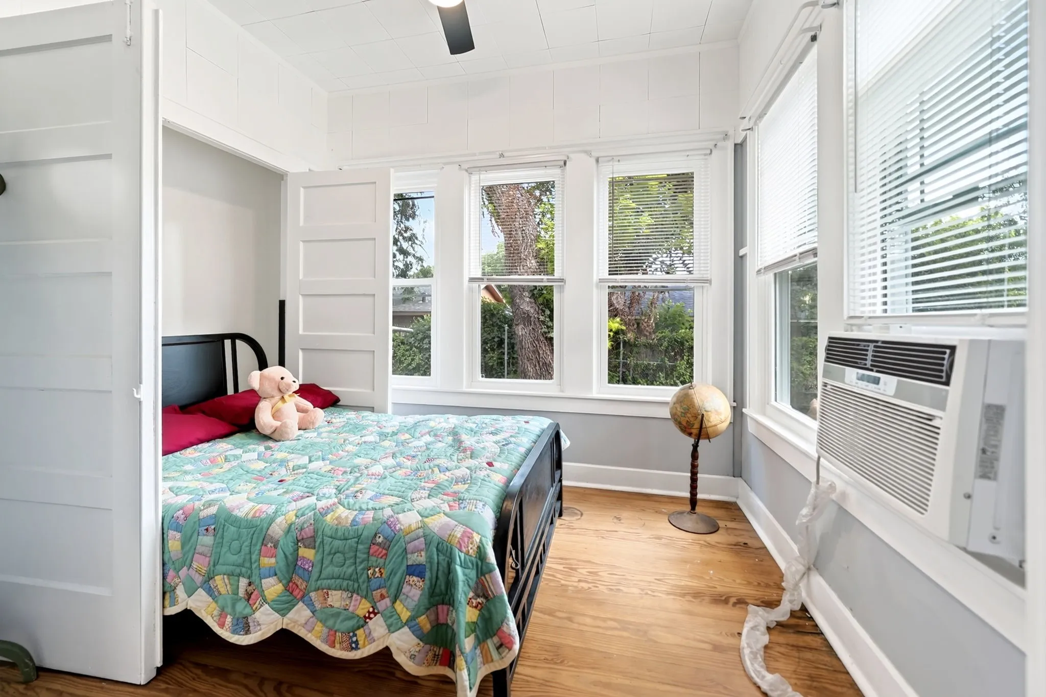 Bright interior room with wood-finish flooring