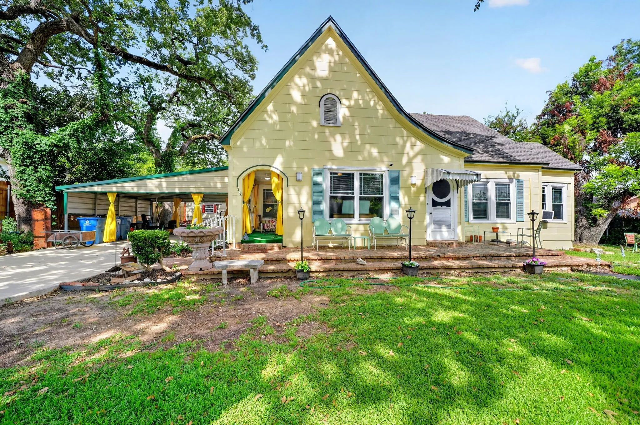 Light yellow exterior with a prominent A-frame gable