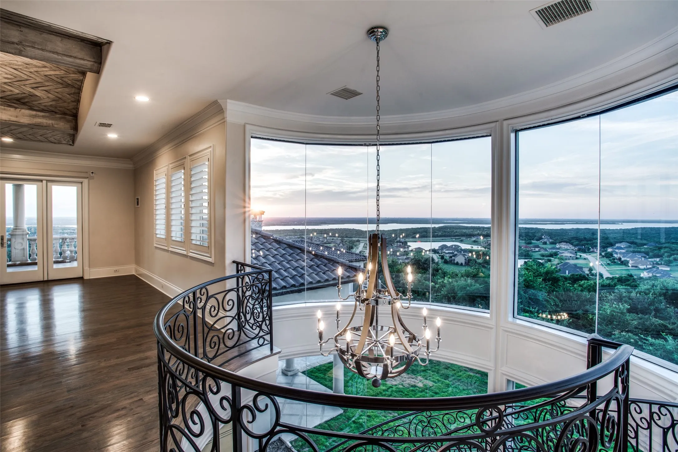 At the top of the floating staircase leading from the kitchen below to the game room above, you have incredible views of Joe Pool Lake, AT&T Stadium and Las Colinas.