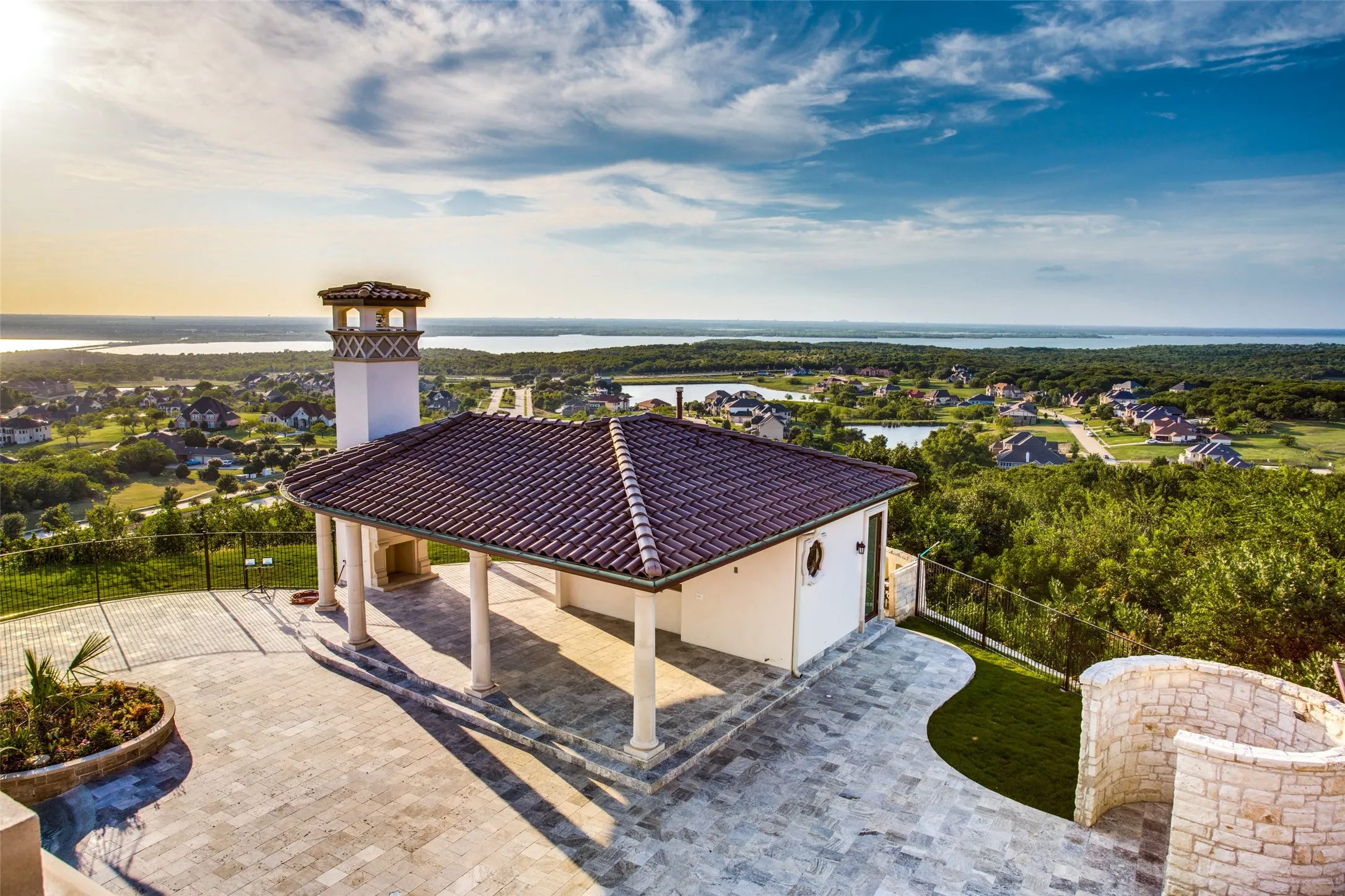 The large cabana provides a large, covered entertainment space at the edge of the hill, overlooking Lake Ridge and Joe Pool Lake.  You truly feel as if you are on top of the world.