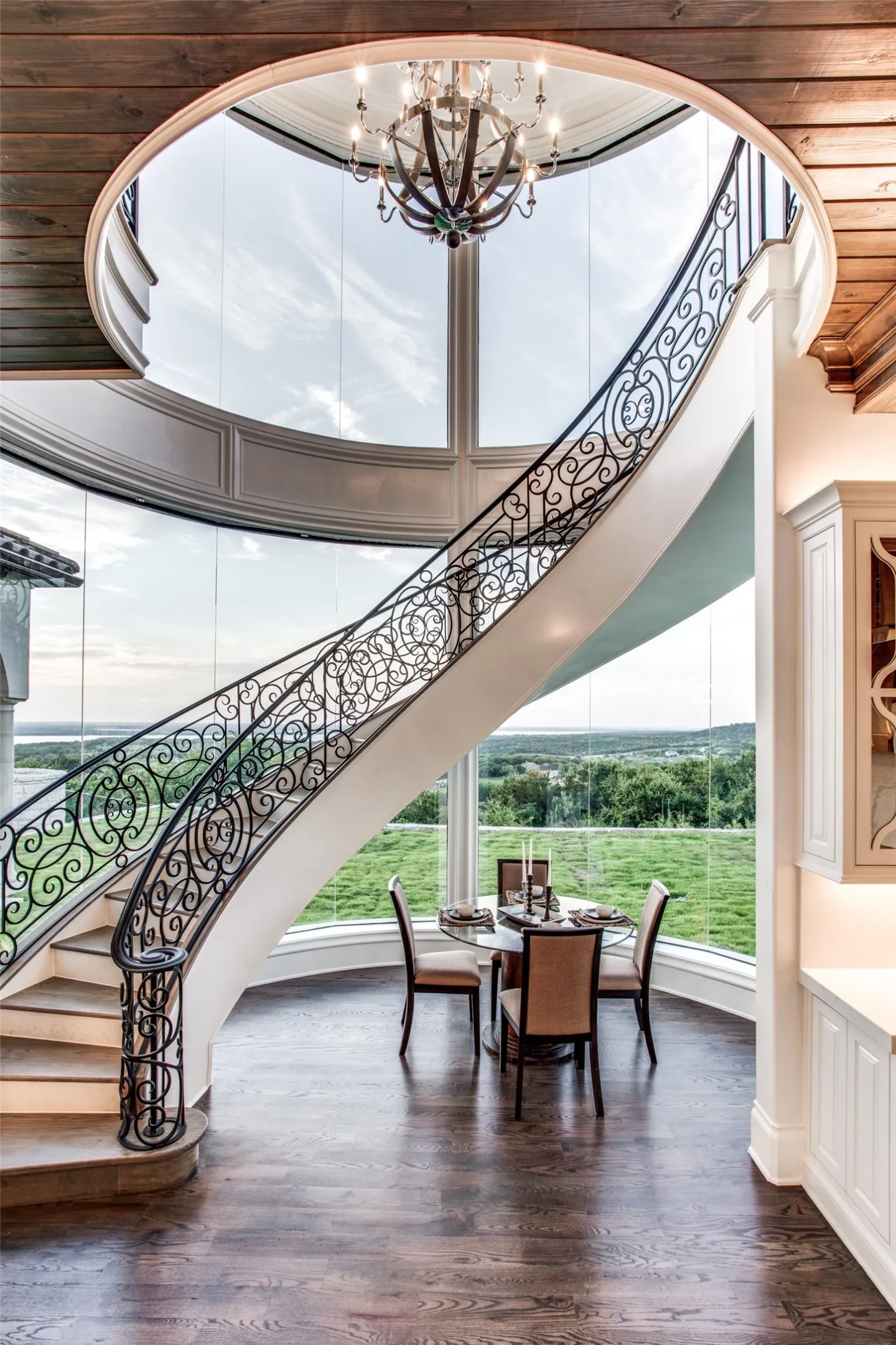 The floating staircase in the kitchen area is a work of art in and of itself!  Surrounding the intimate breakfast area, the views of the surrounding hills and of Las Colinas in the distance are awe-inspiring!