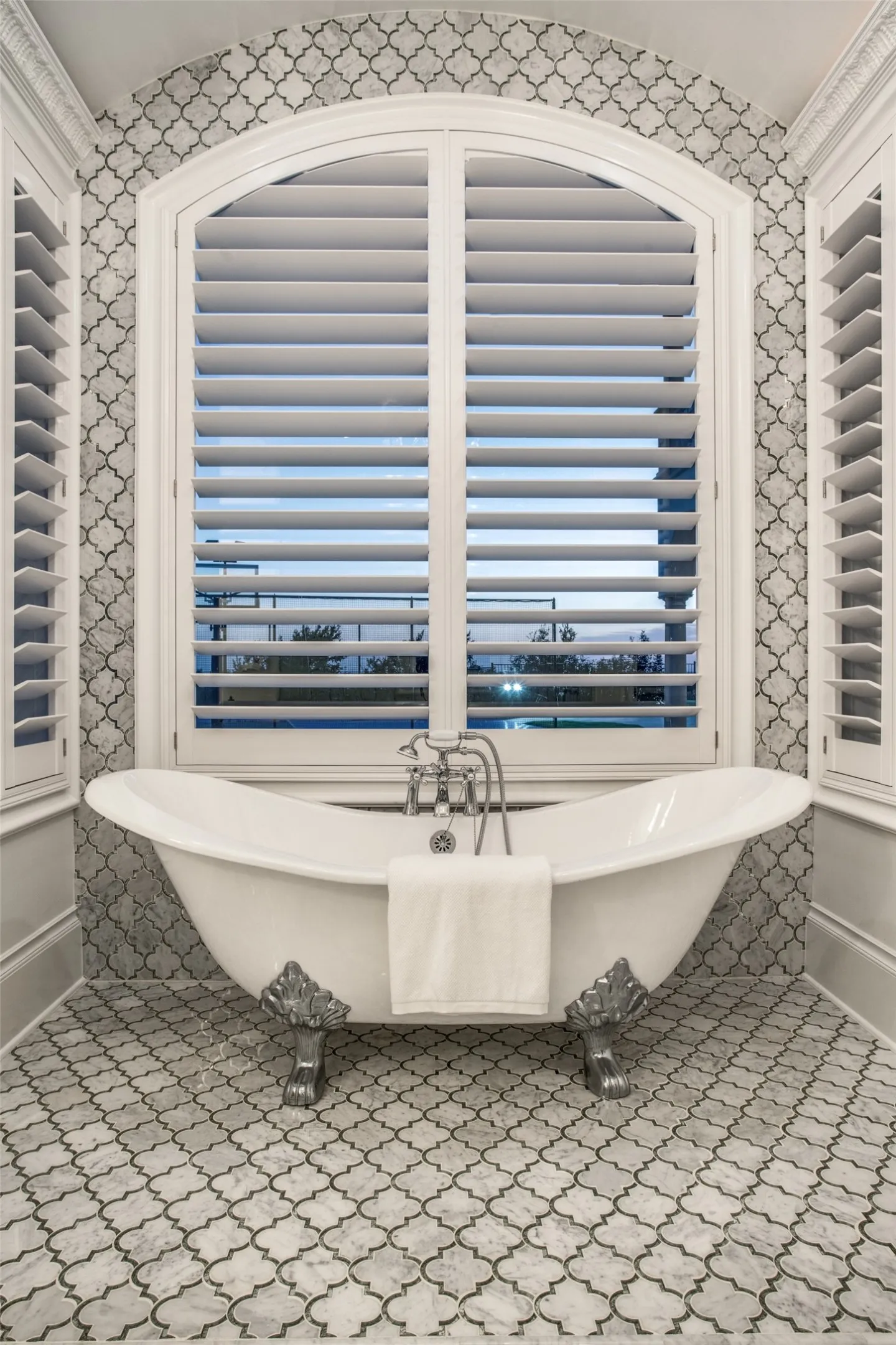 A soaking tub rounds out the luxury of the primary bath!  Notice the amazing tile and elegance of the room!
