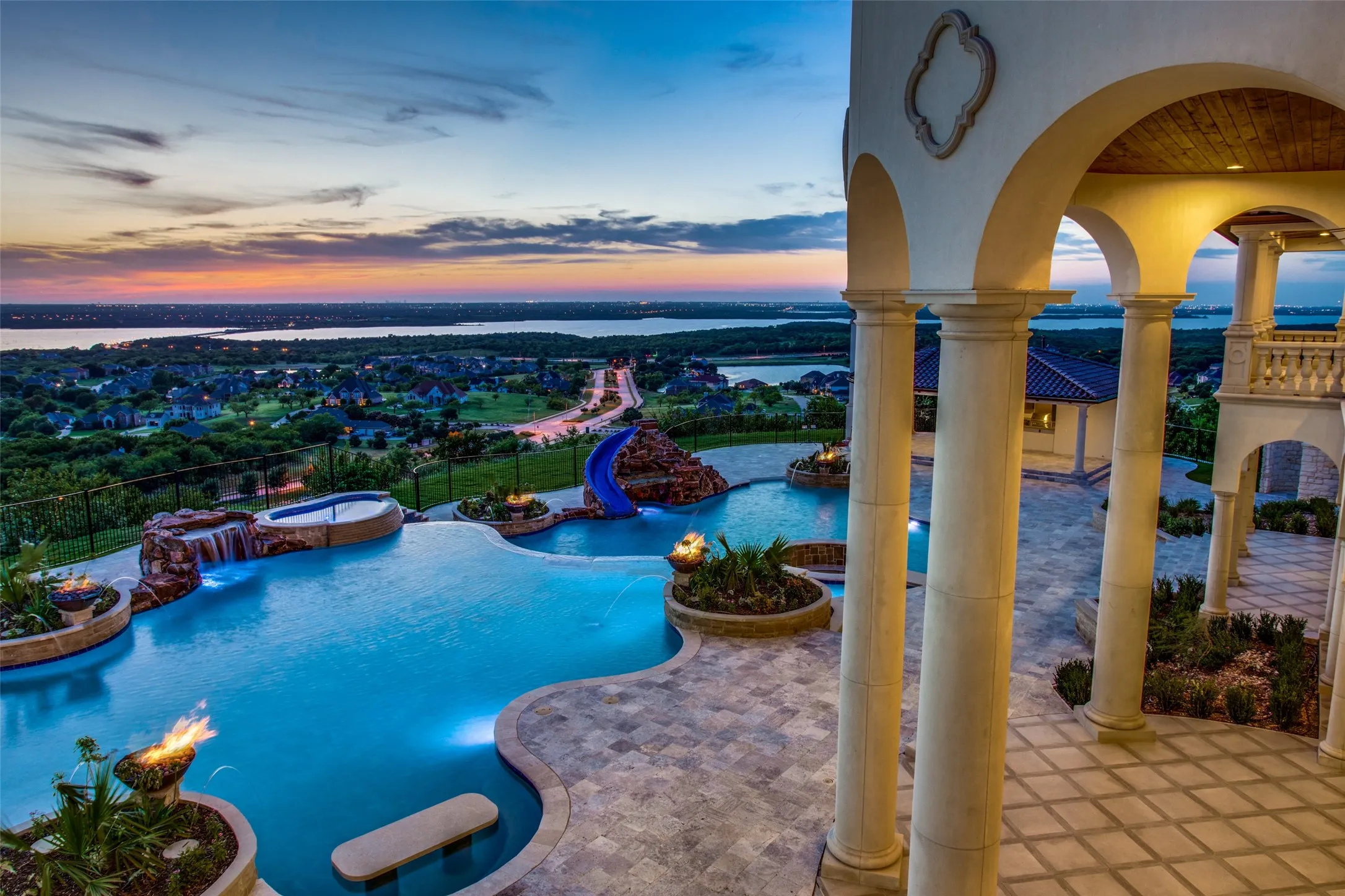 You feel as if you own the entire lake and valley from your private retreat as you look over your fabulous pool, across Lake Ridge and Joe Pool Lake.