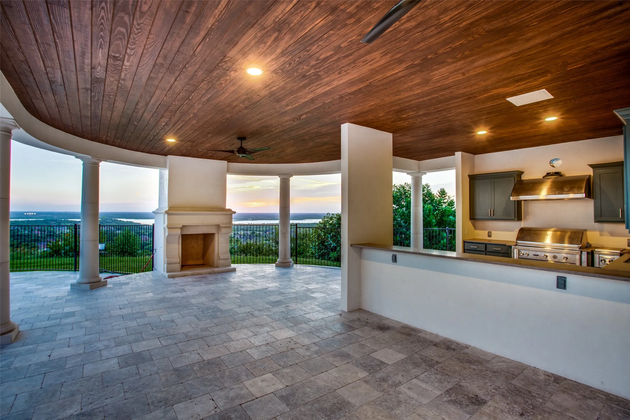 The cabana is ready for entertaining, with a well appointed outdoor kitchen, a separate bath and large fireplace.
