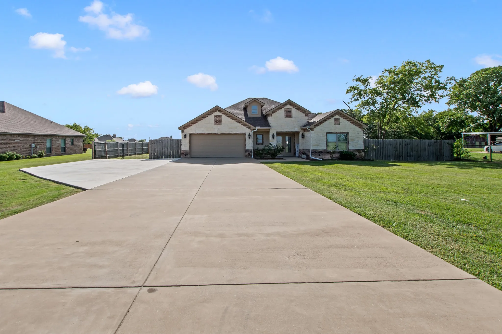 Front exterior of home with expanded driveway