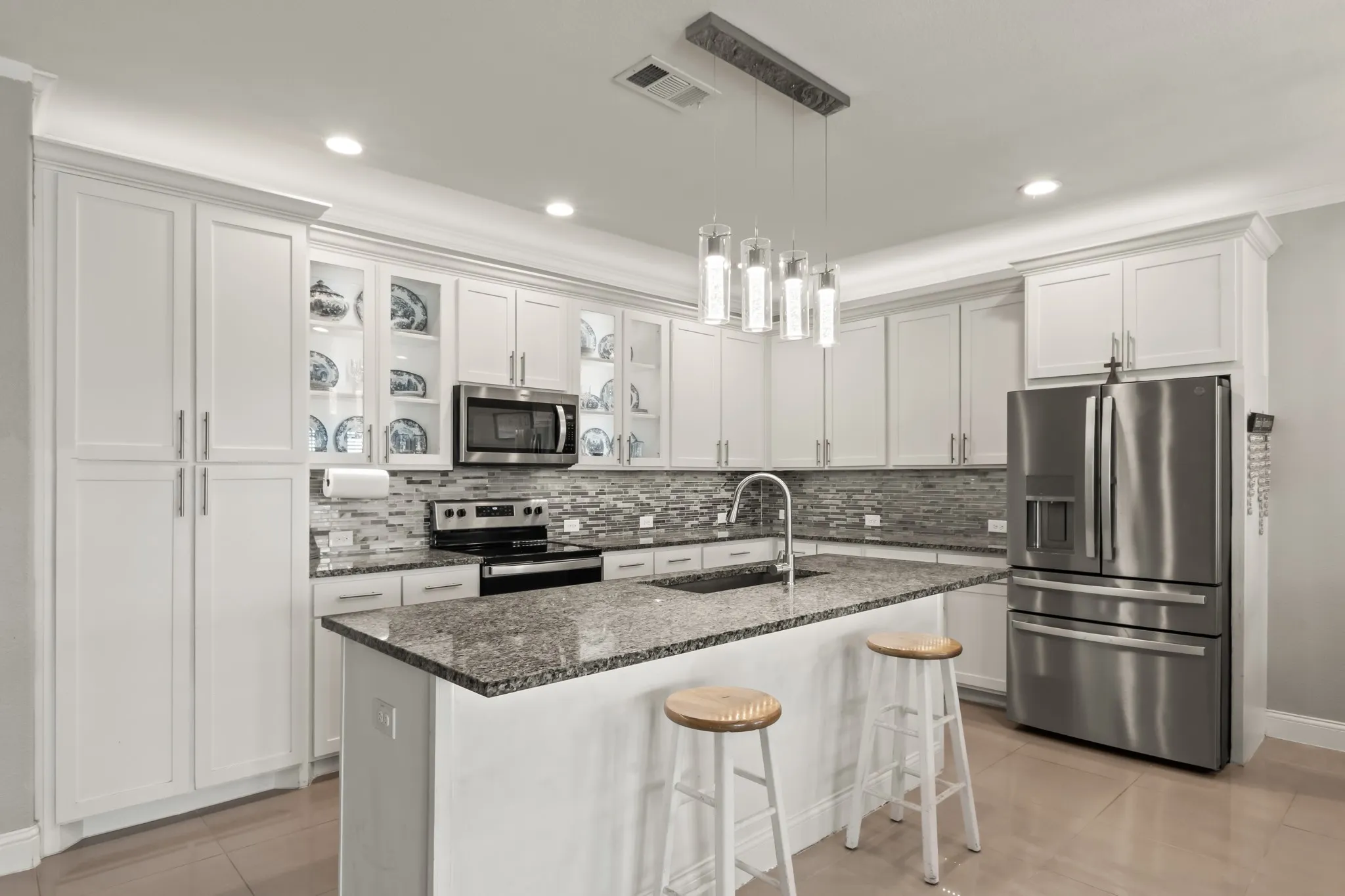 Well-appointed kitchen featuring stainless steel appliances and a large center island