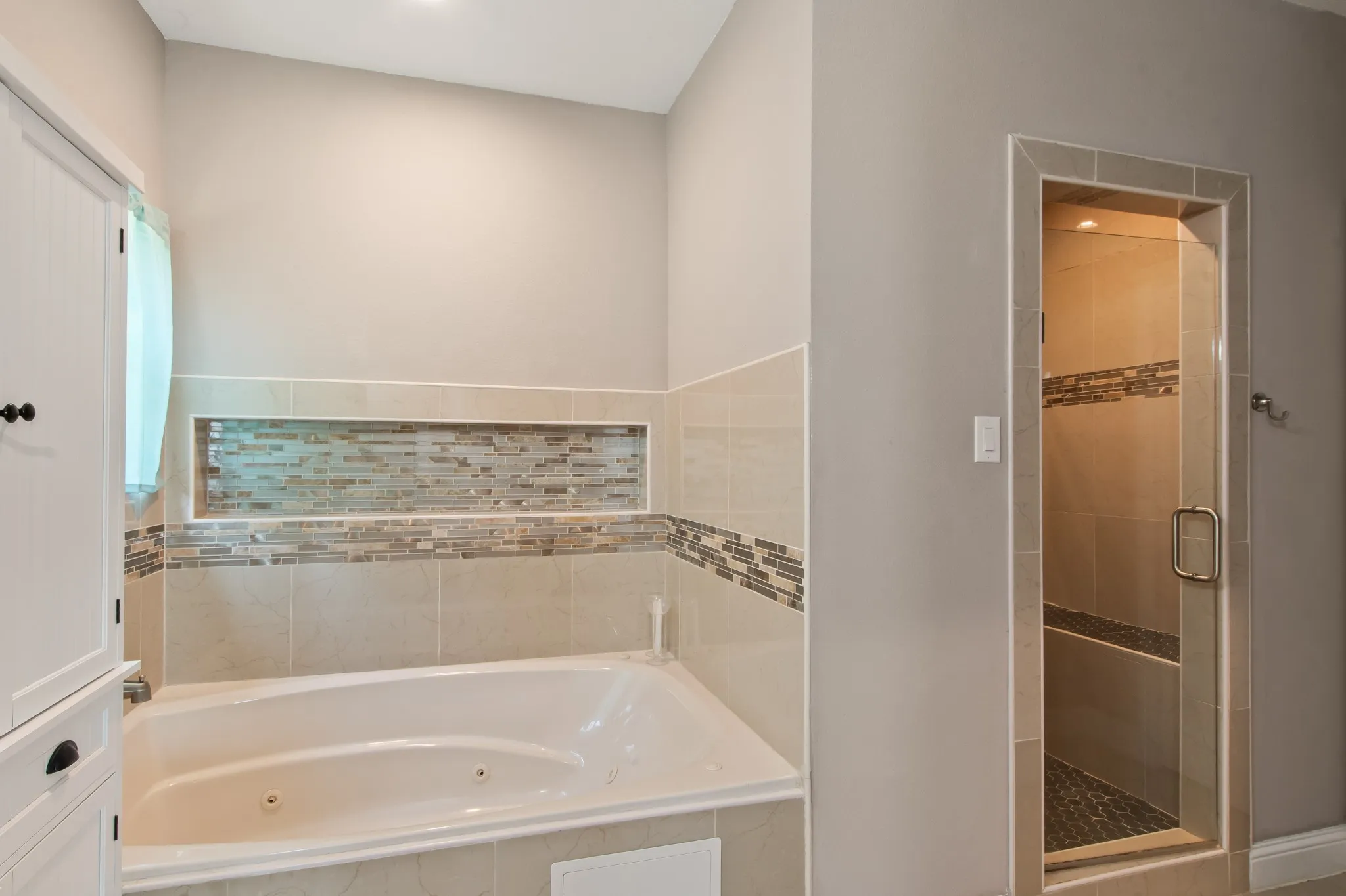 Primary Walk in Tile Shower and Jacuzzi Tub