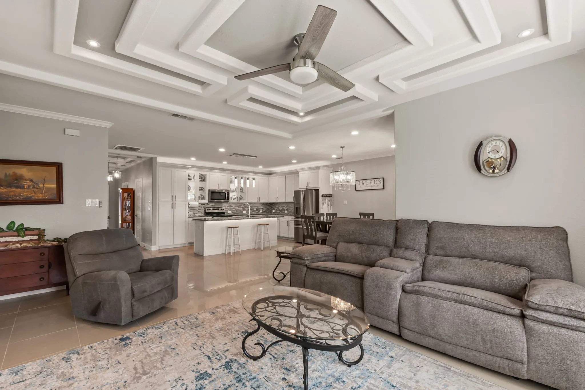 Open-concept living area flowing seamlessly into the kitchen and dining space