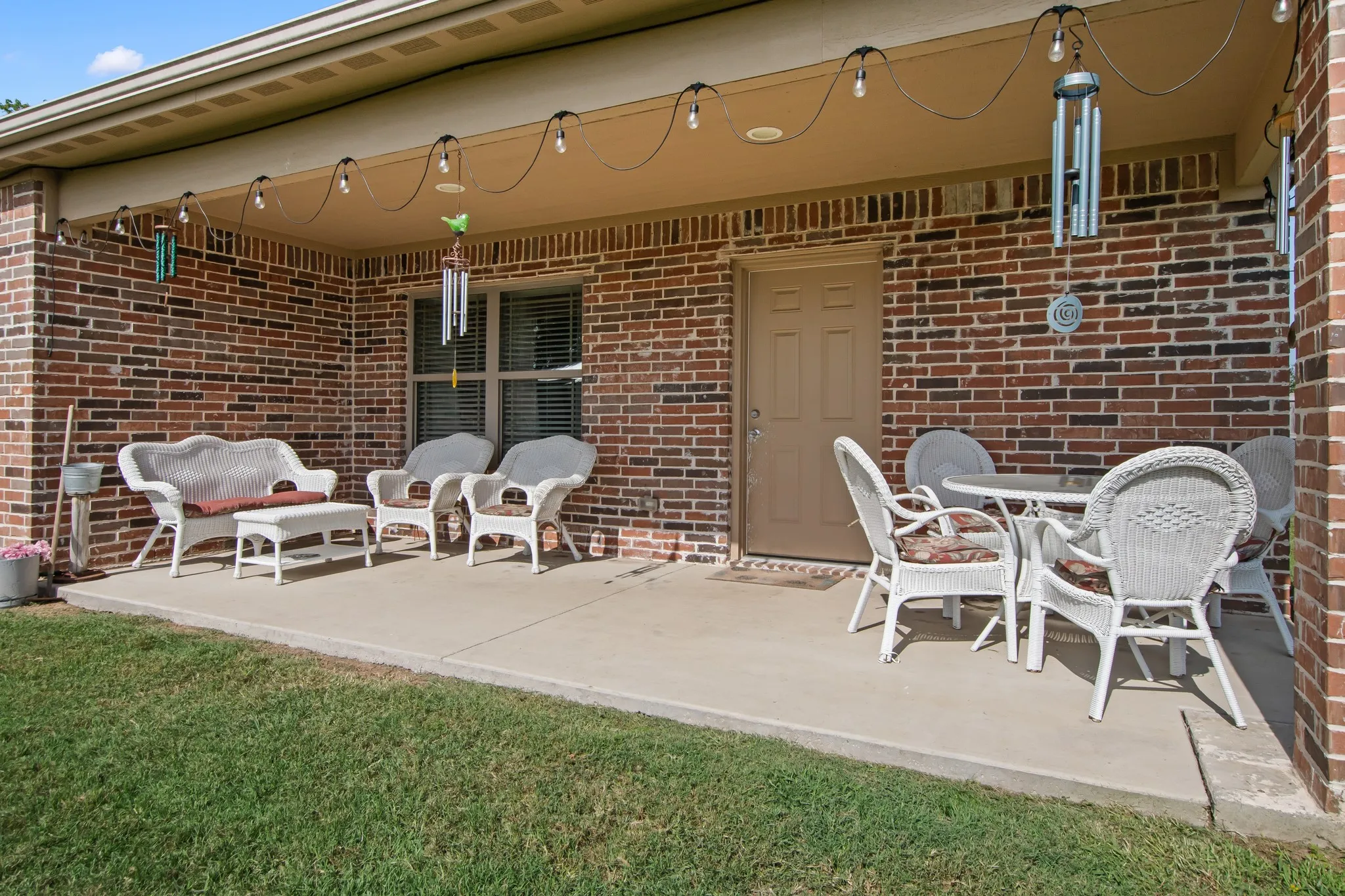 Covered back patio overlooking the spacious backyard