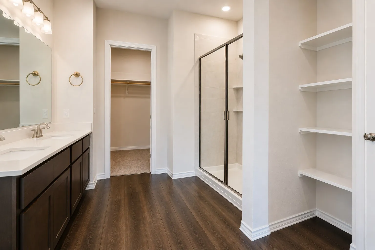Dual sink vanity with white countertop, dark wood-finish cabinetry, and brushed nickel fixtures