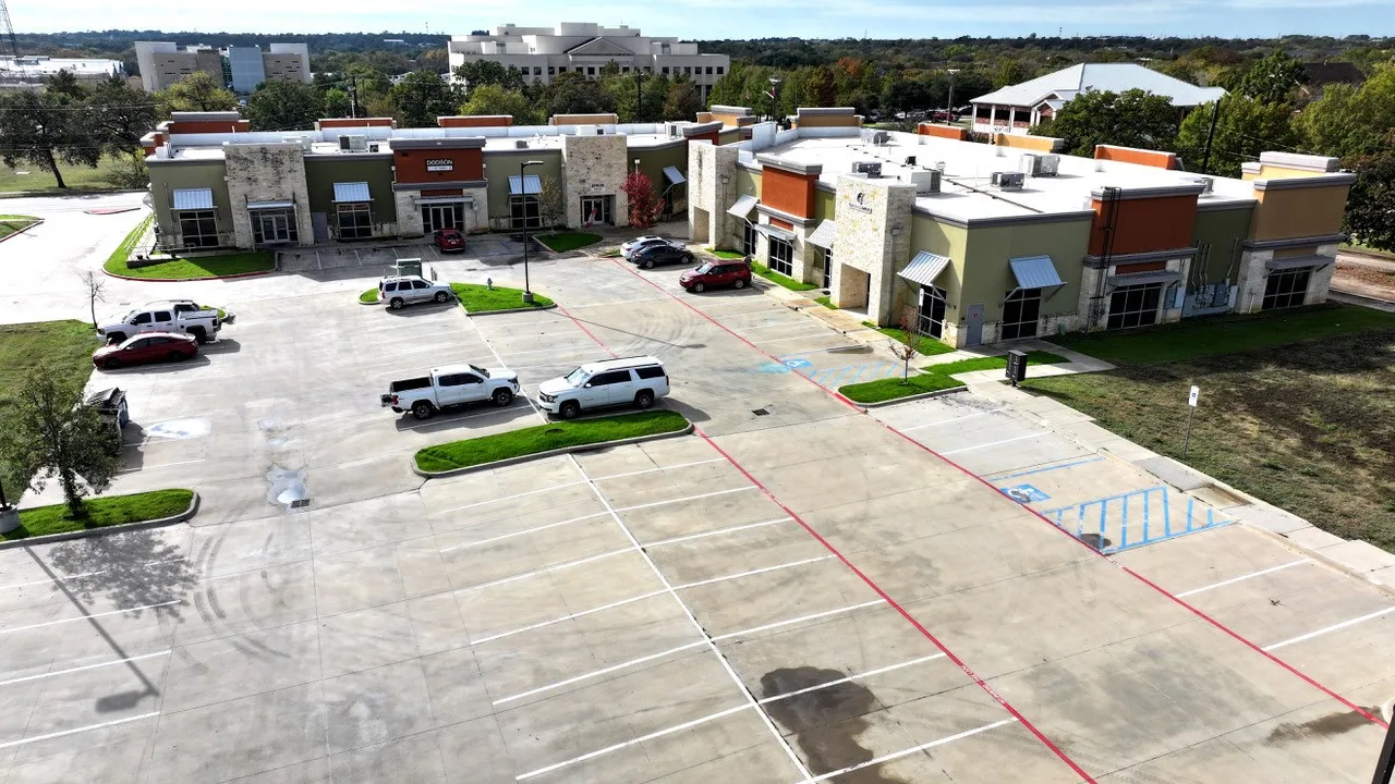 View from north end of parking lot with the Denton Court Complex in background