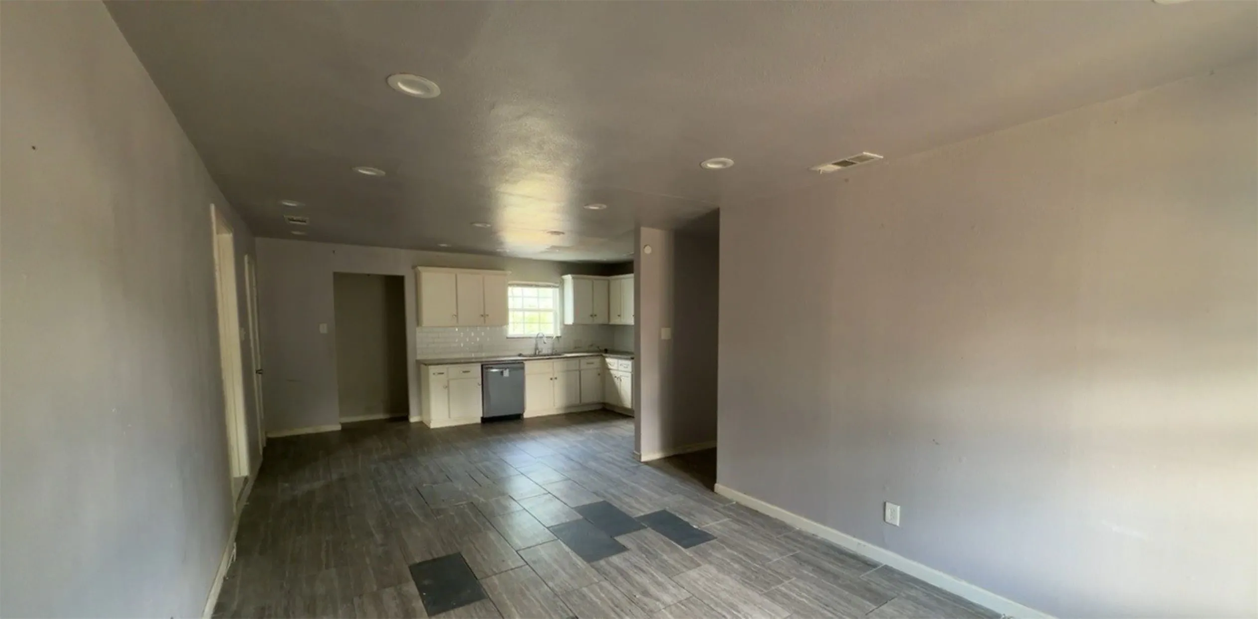 Enter into the living room open to kitchen/dining.