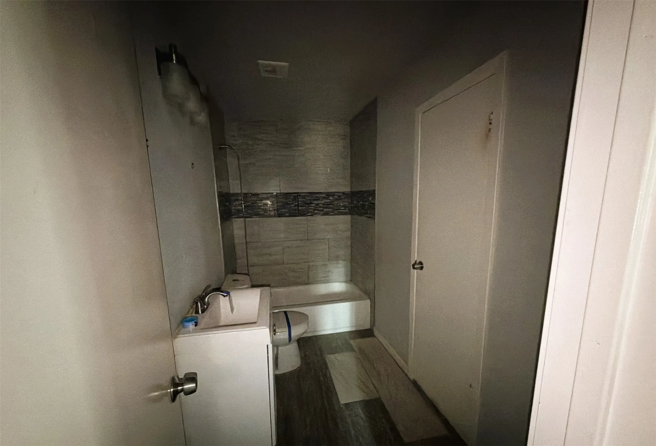 Full bath shared by auxiliary bedrooms.