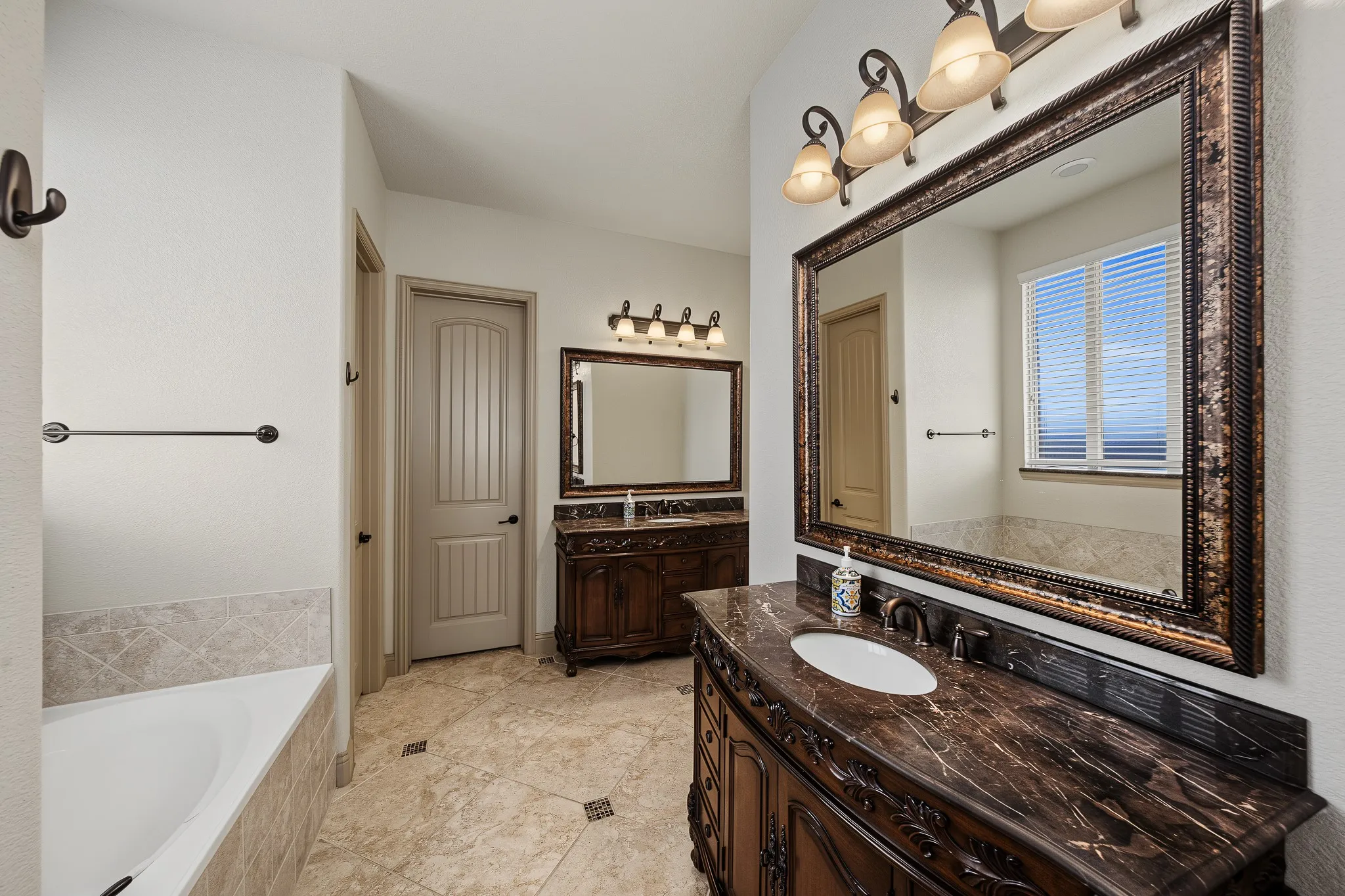 Primary bathroom with dual vanities