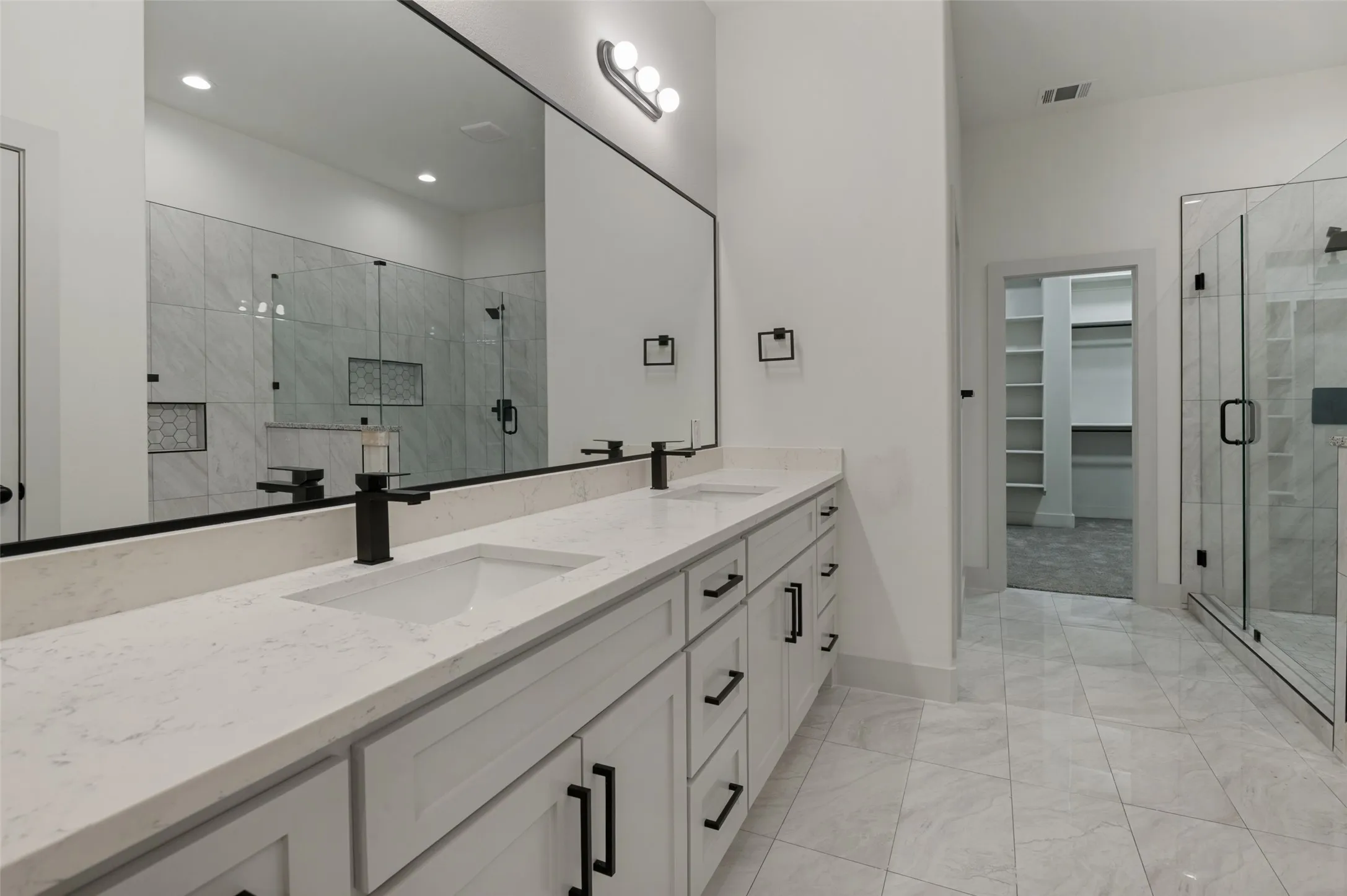 Dual vanity with undermount sinks and matte black fixtures