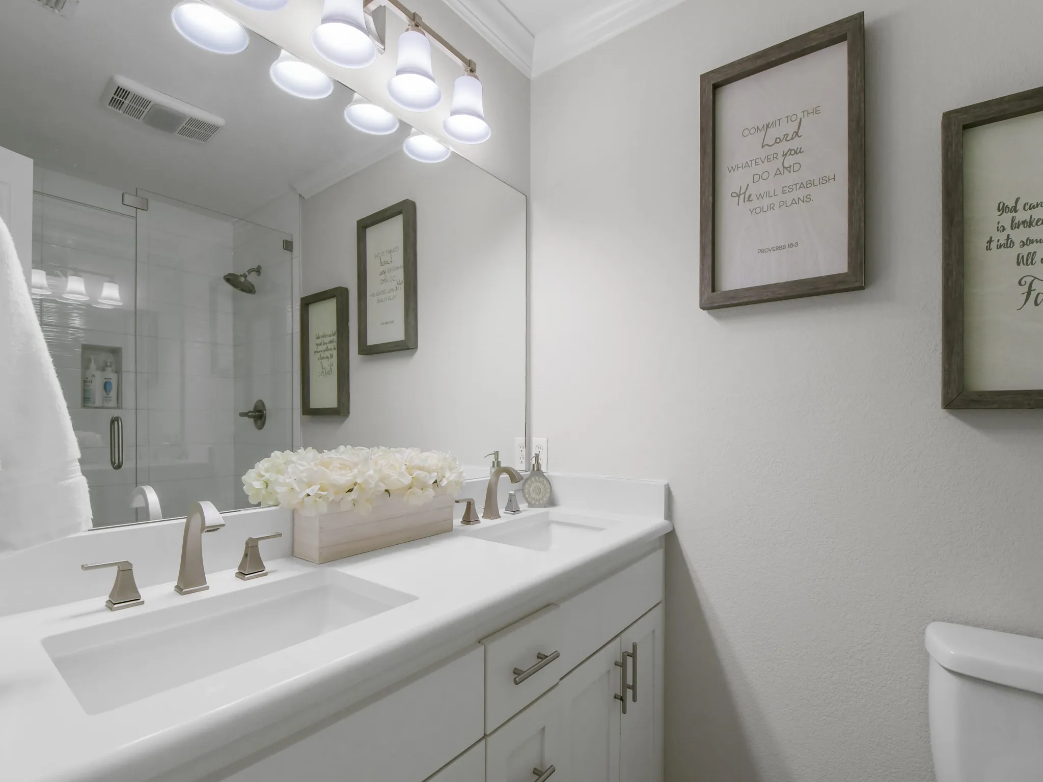 Dual vanity with integrated sinks and brushed nickel faucets