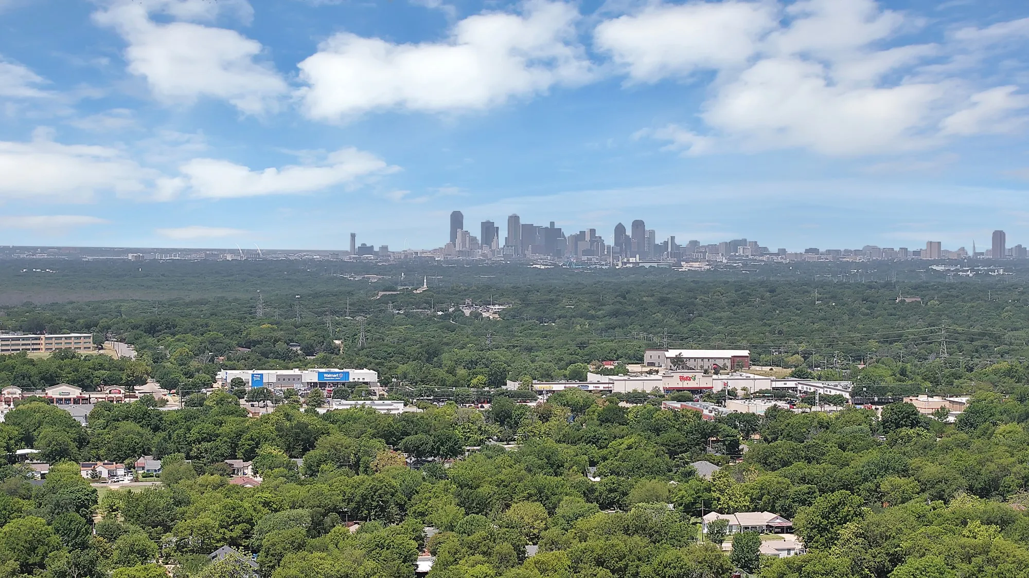 Expansive skyline backdrop featuring a cityscape and distant skyscrapers