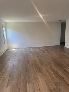 Wood-finish flooring with light-toned walls