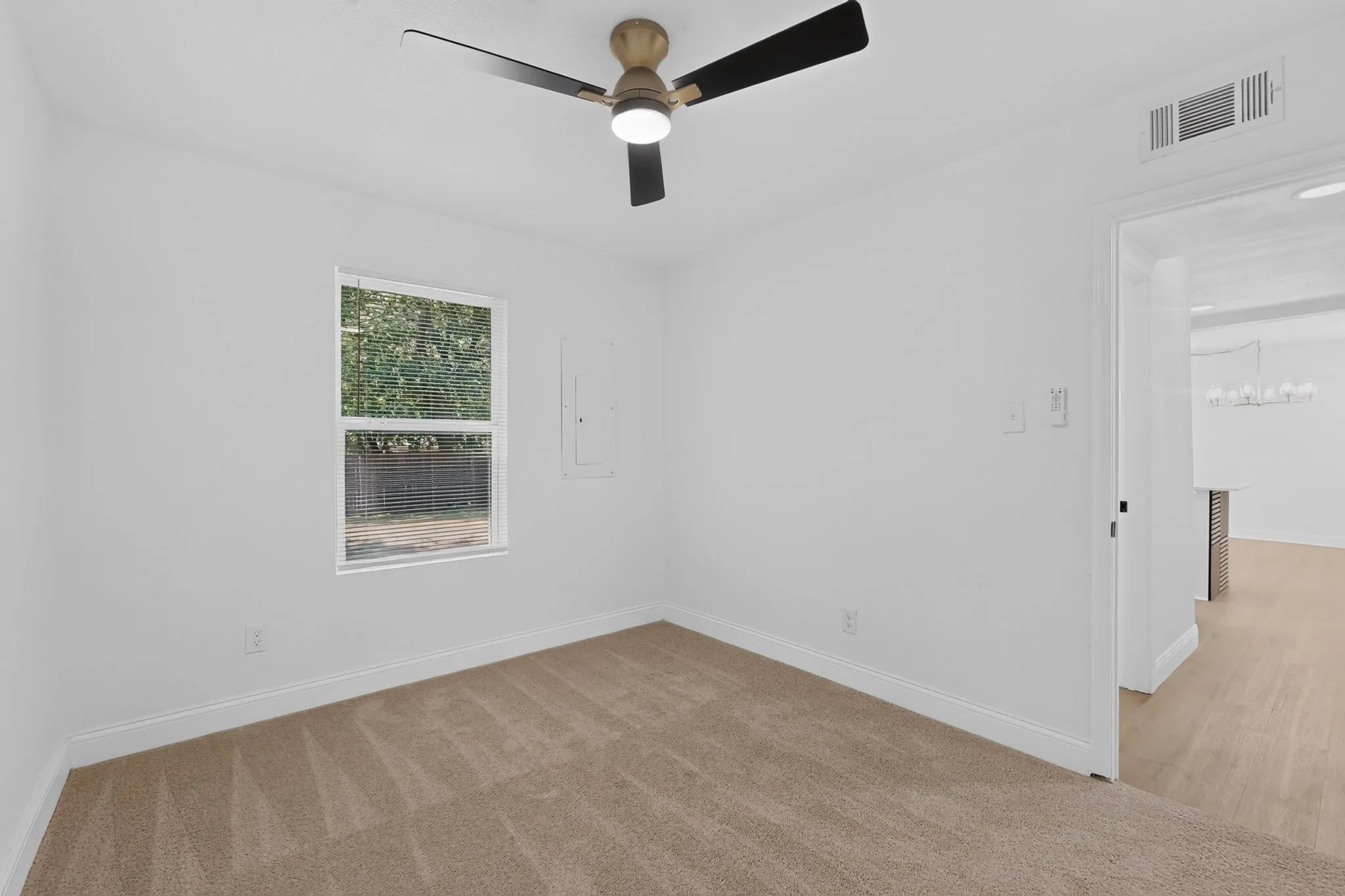 Bedroom 3 different angle with neutral carpeting and white wall finishes