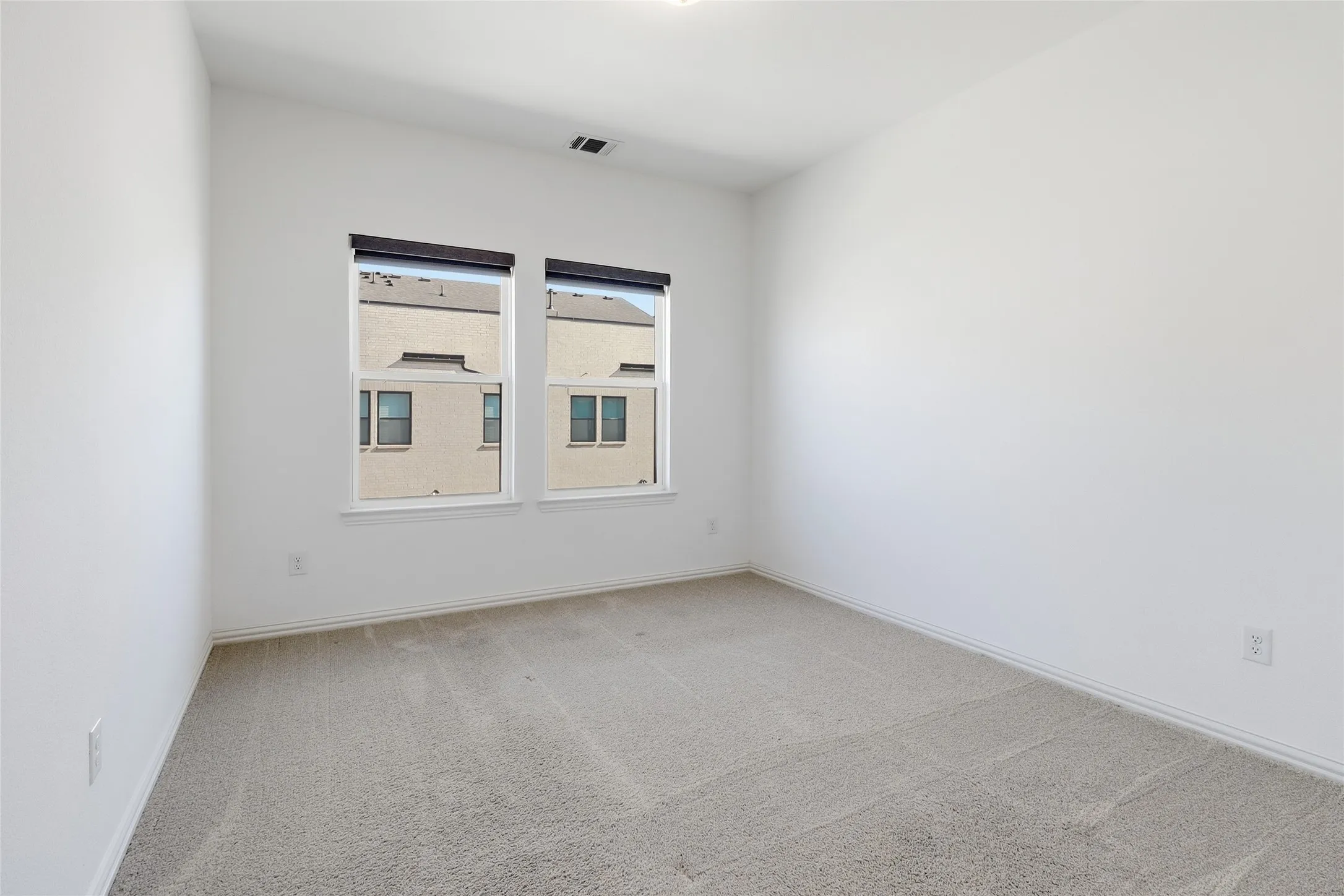 Neutral toned carpeting throughout