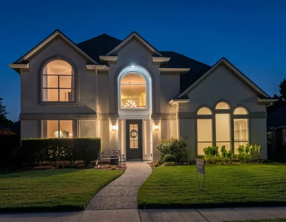 Stucco exterior with multiple gables and arched windows