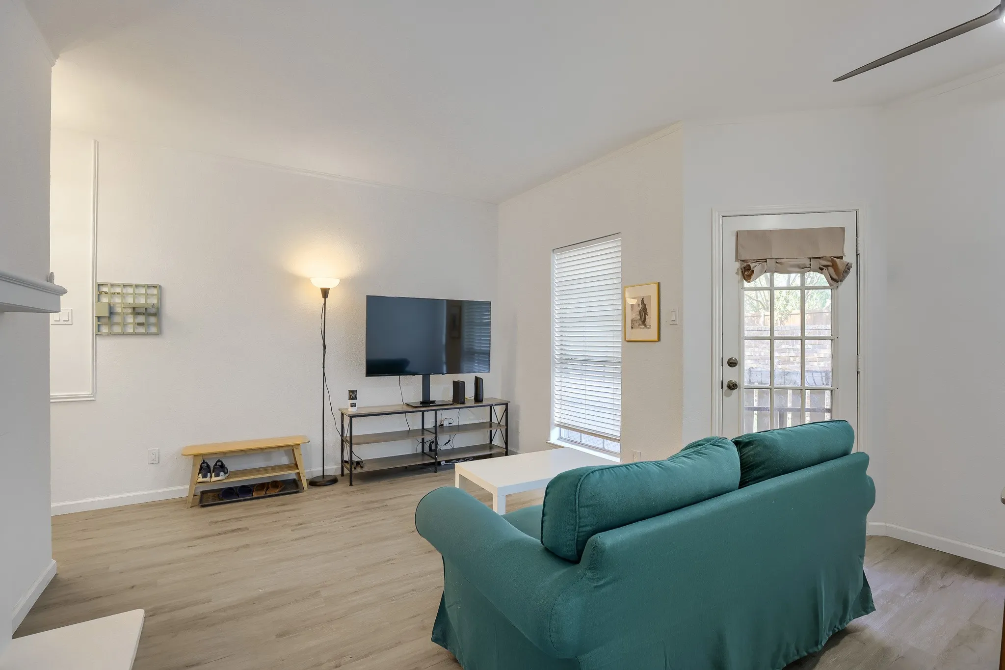 Vaulted ceilings extend over wood-finish flooring