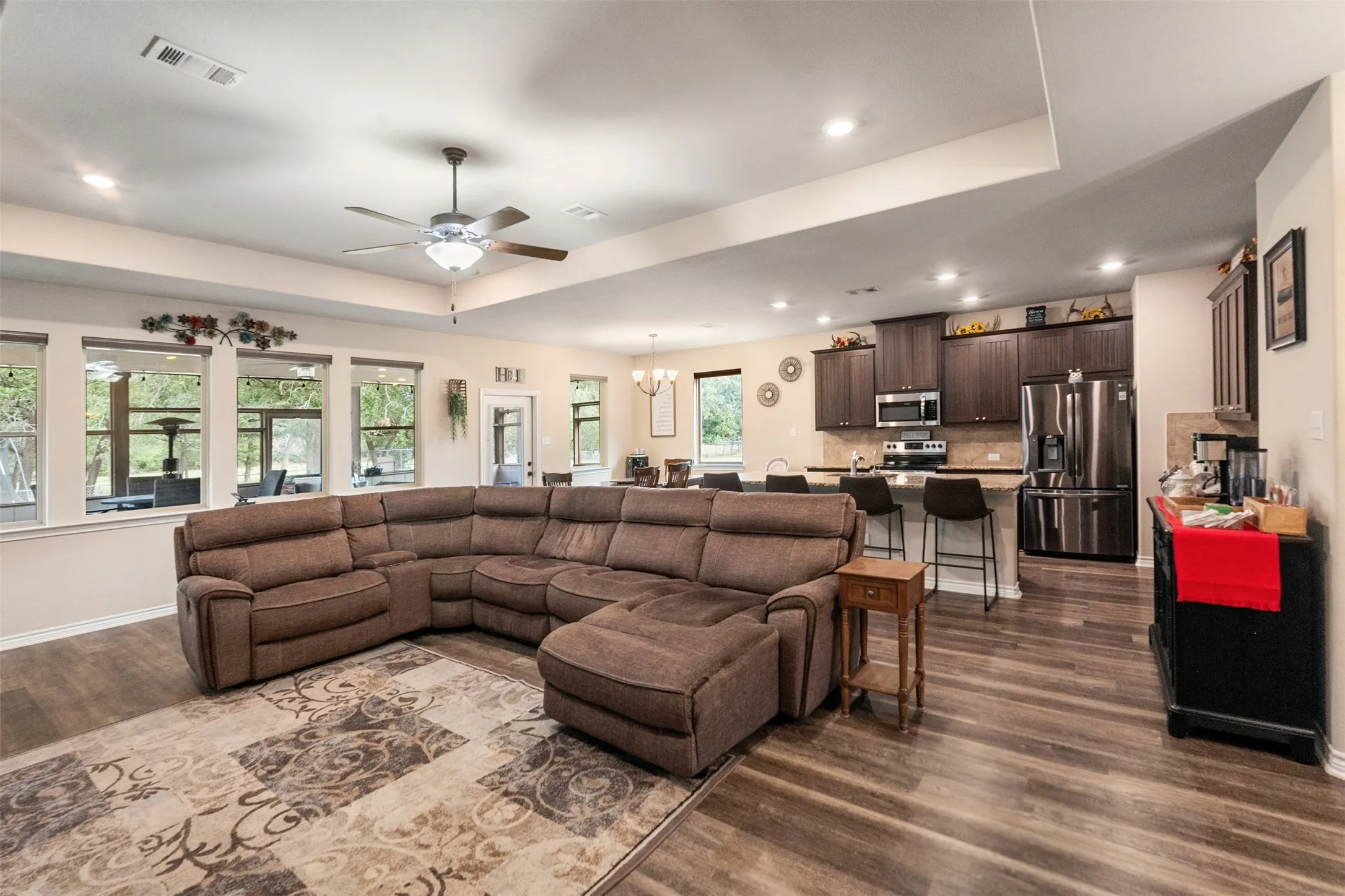 Beautiful Open-concept living space featuring wood-finish flooring, recessed lighting, and a ceiling fan