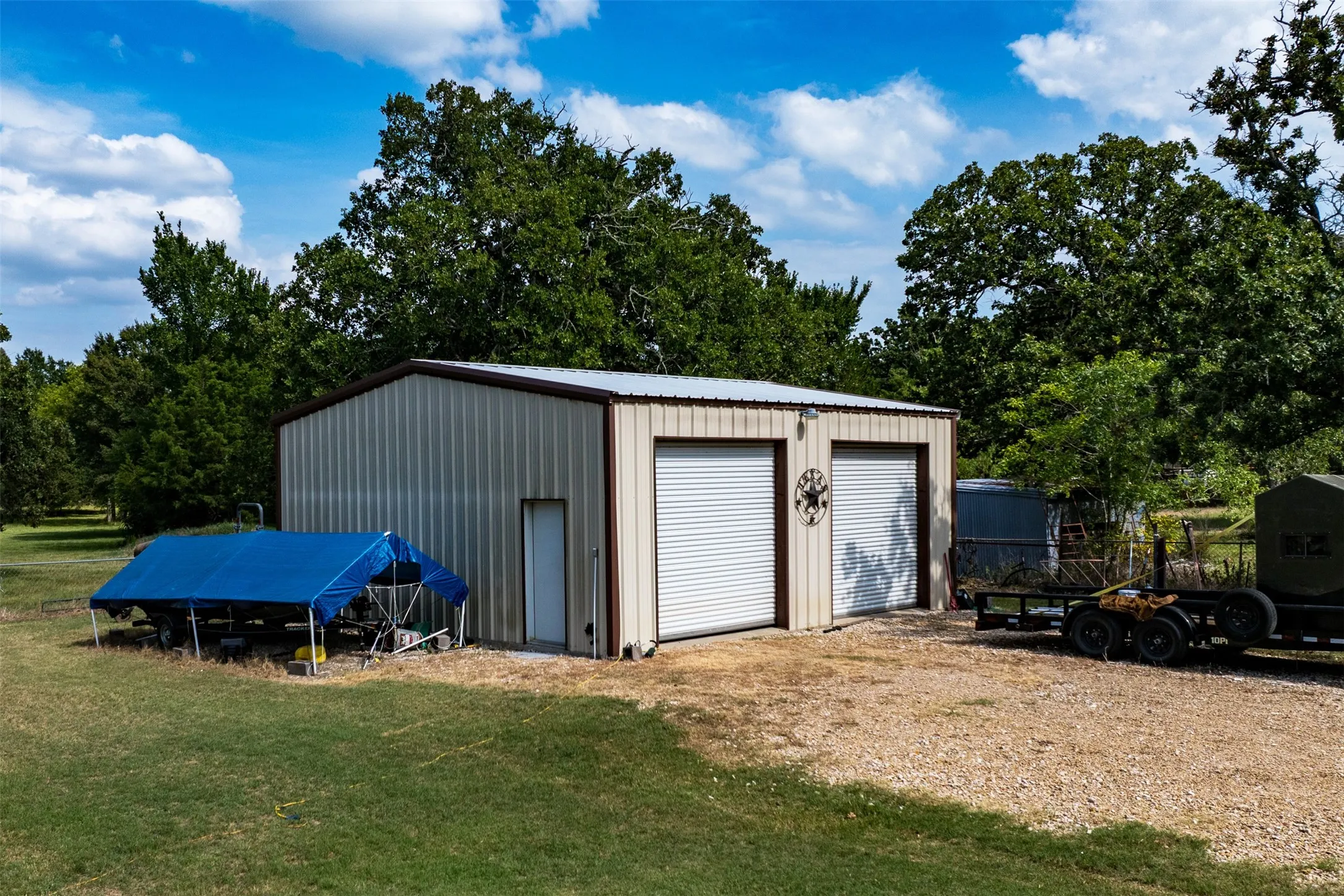 Large detached 2 bay door garage.  30x30 insulated and has electricity