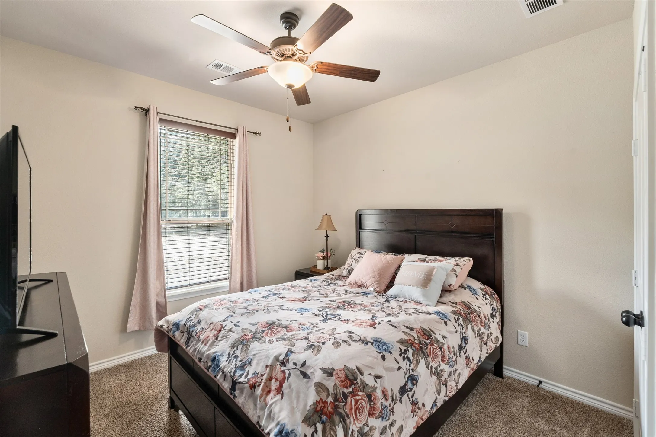 Interior room featuring light-colored walls and carpet flooring