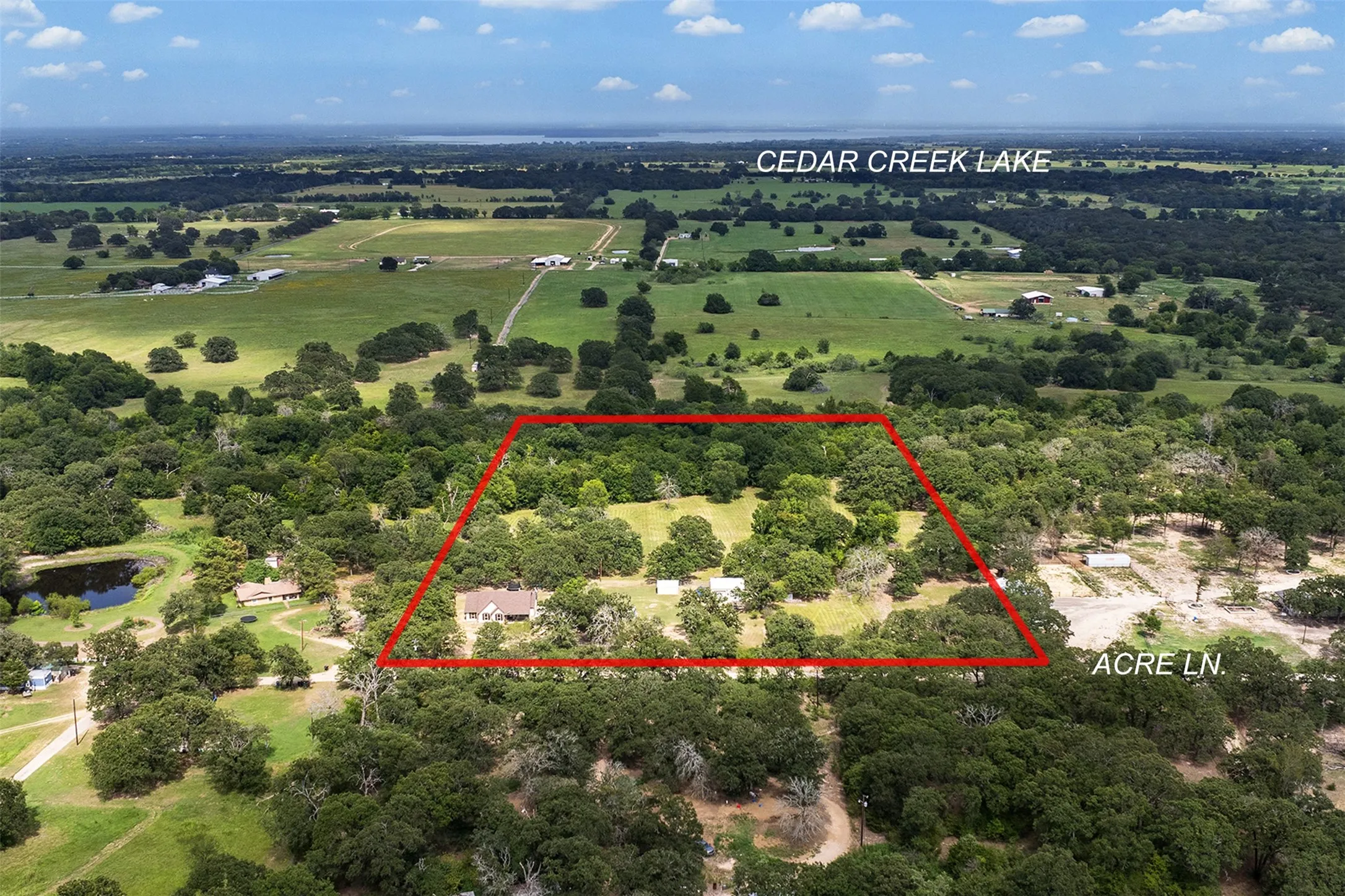 Expansive land parcel featuring dense tree coverage and multiple clearings.  Boundry lines approximate.