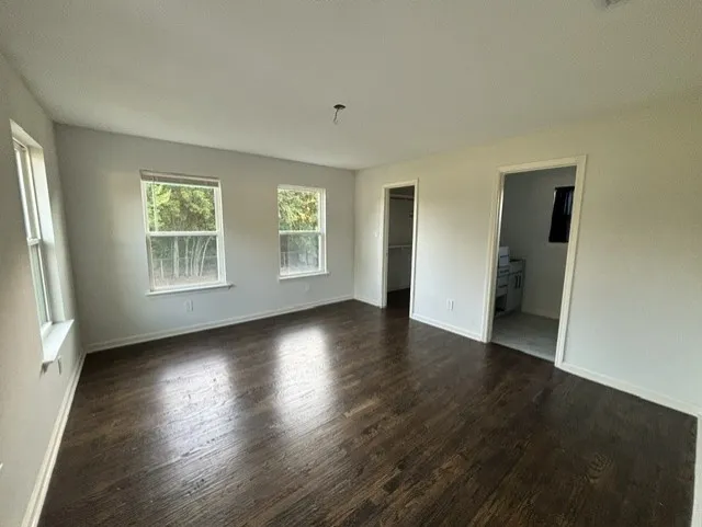 Another view of the primary bedroom.  There is no shortage of natural light!