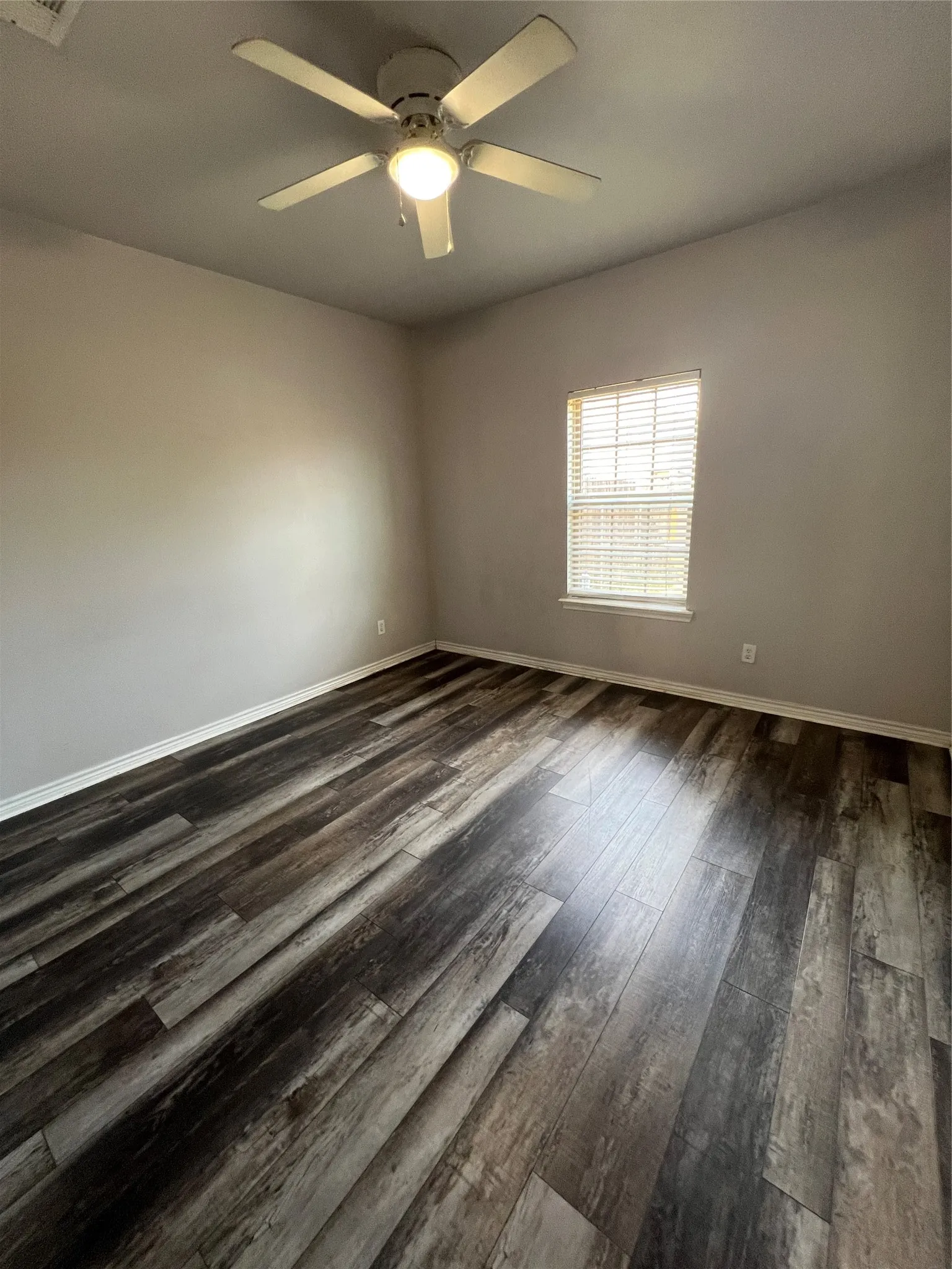 Wood-finish flooring with baseboard trim