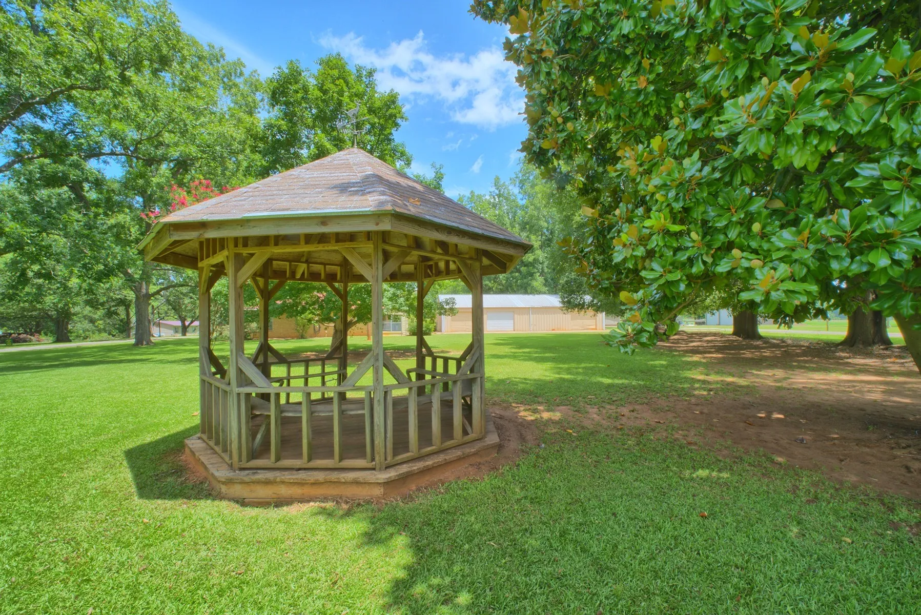 beautiful gazebo in front yard with views of lake