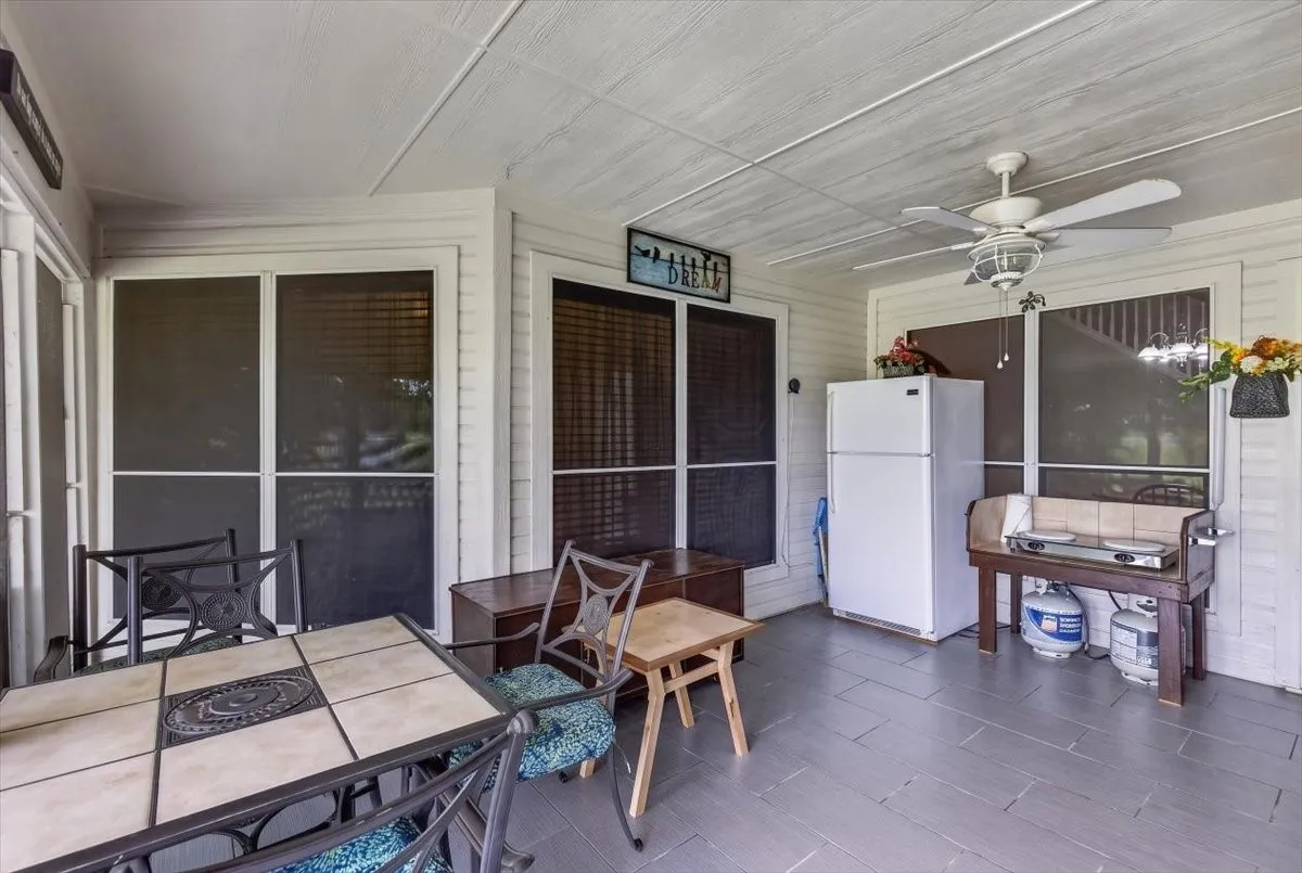 Screened patio with tile flooring