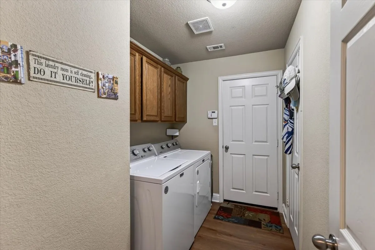 laundry room with upper cabinets