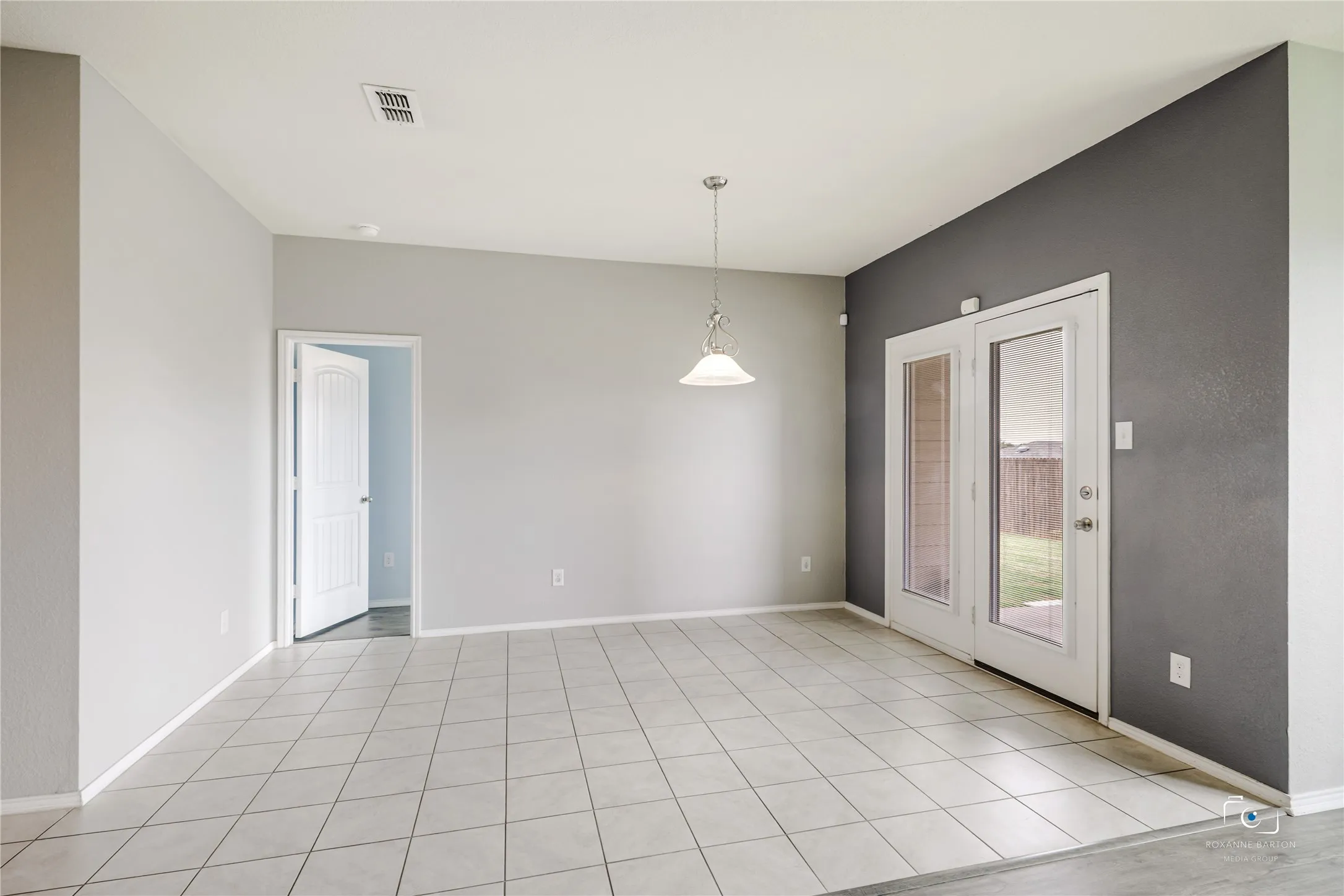 Large dining area with wall for furniture placement