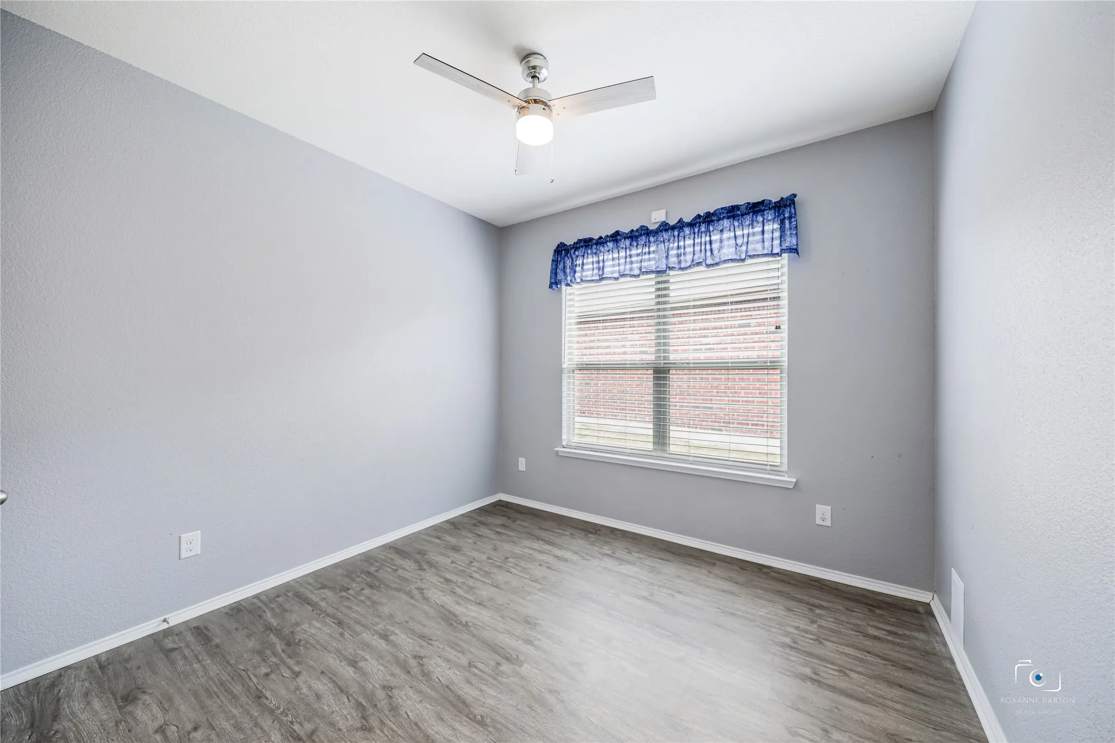 Secondary bedroom with luxury vinyl flooring