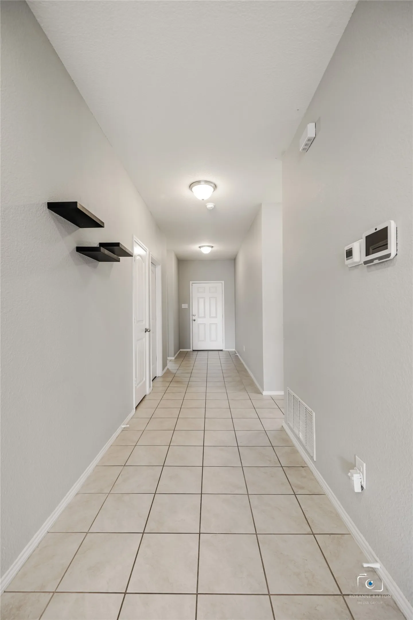 Entry foyer hallway view from the Kitchen.