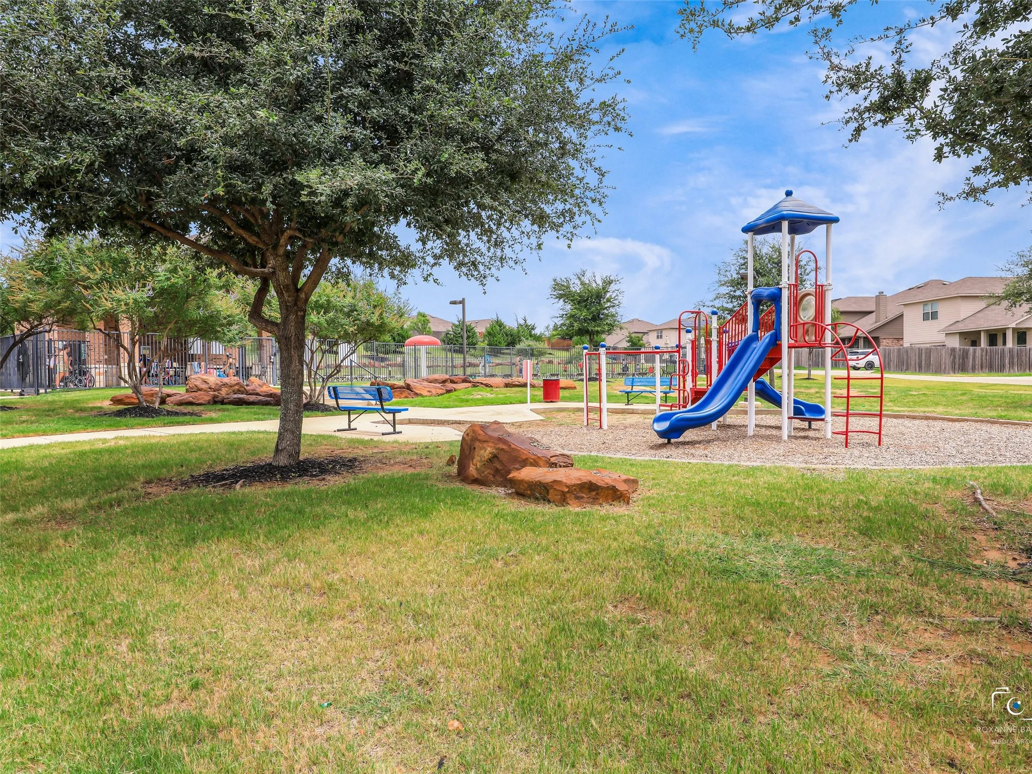 View of the community playground and pool, located across the street for ease of access.