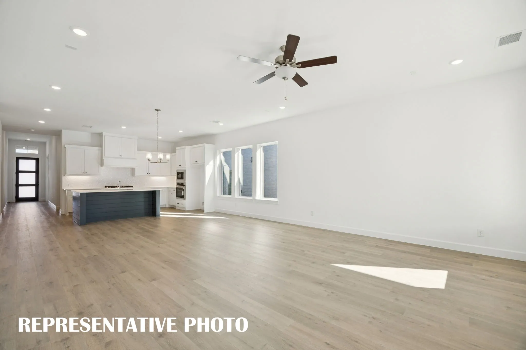 Light, bright and airy, this open concept kitchen-dining-family room is everything you have been searching for!  REPRESENTATIVE PHOTO