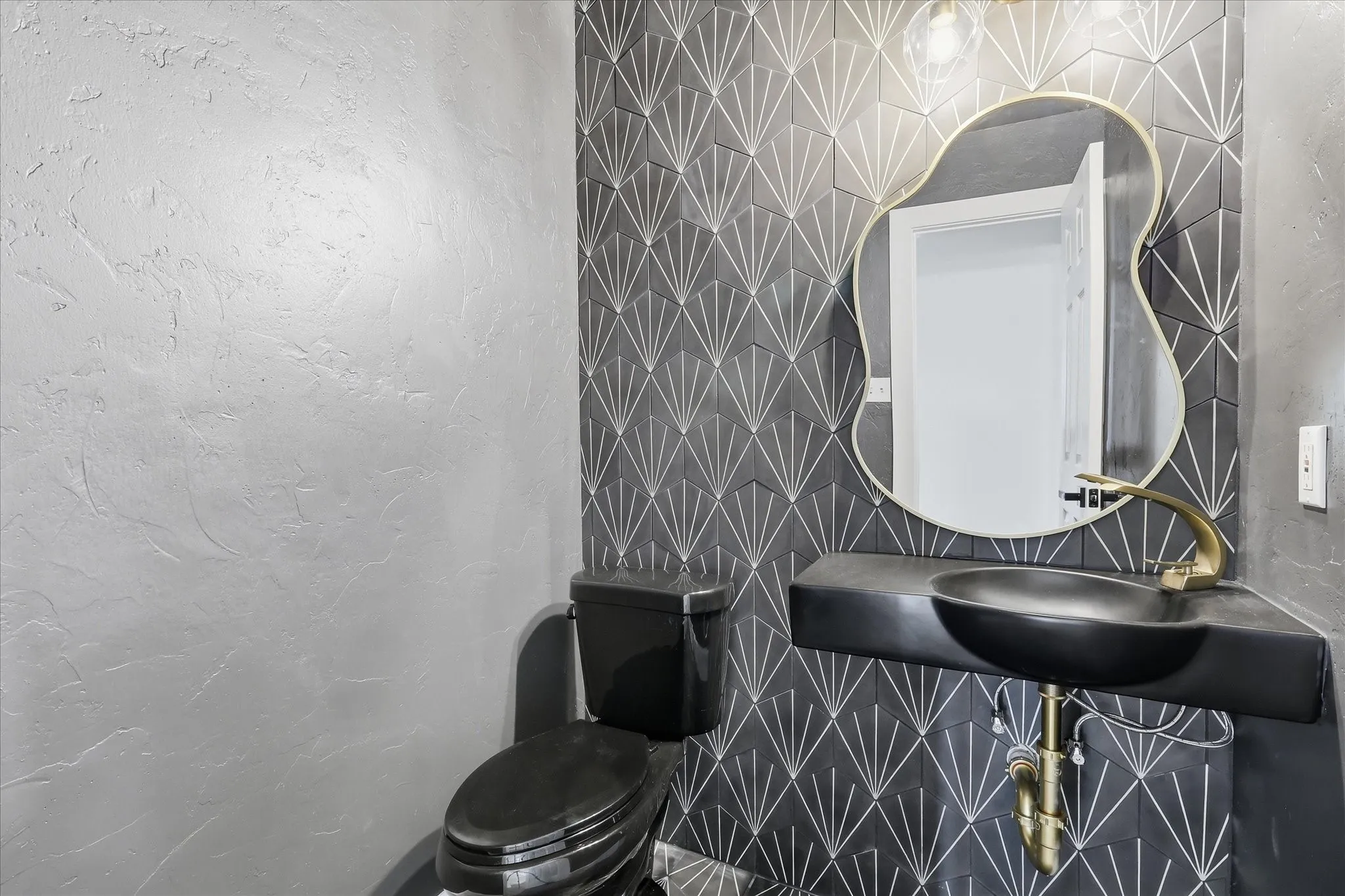 Textured wall finish complementing a tiled accent wall