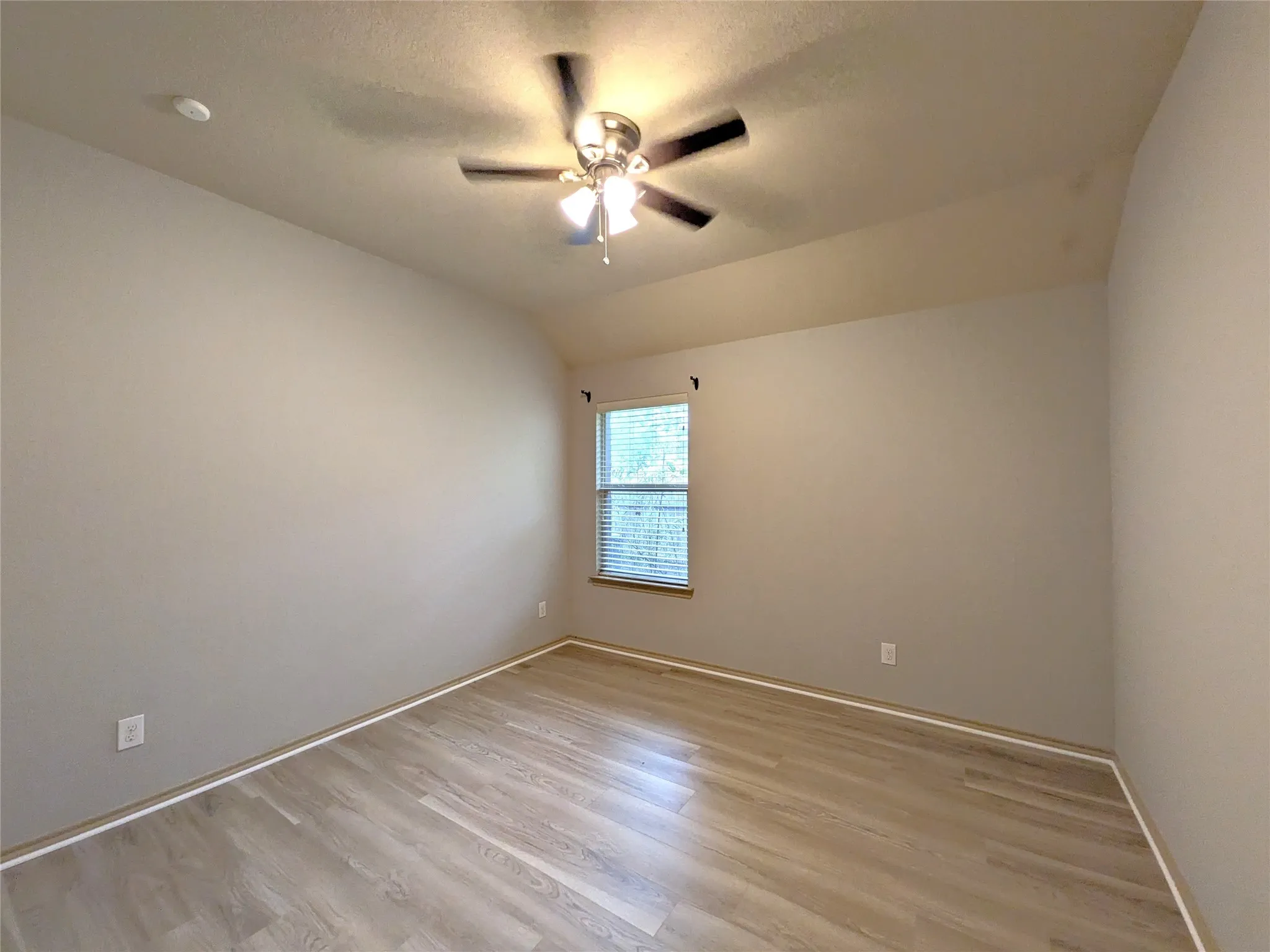 Neutral-toned interior with wood-finish flooring
