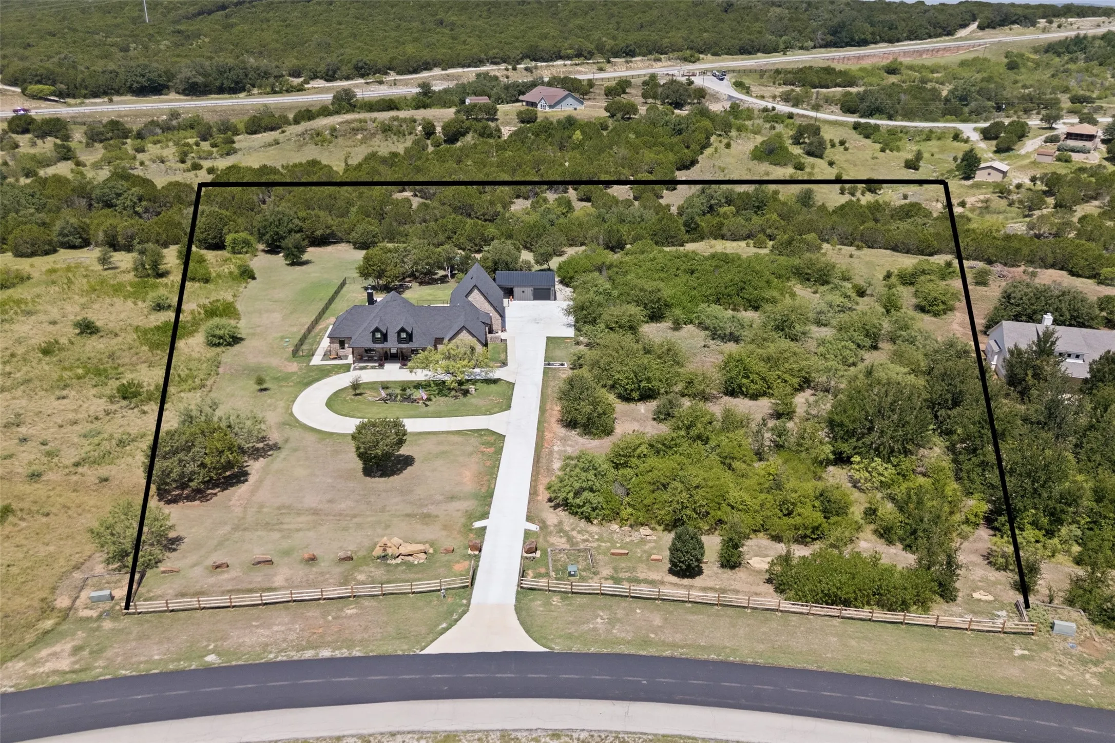 4 acres, custom home, insulated shop, creek on the property, split rail fence