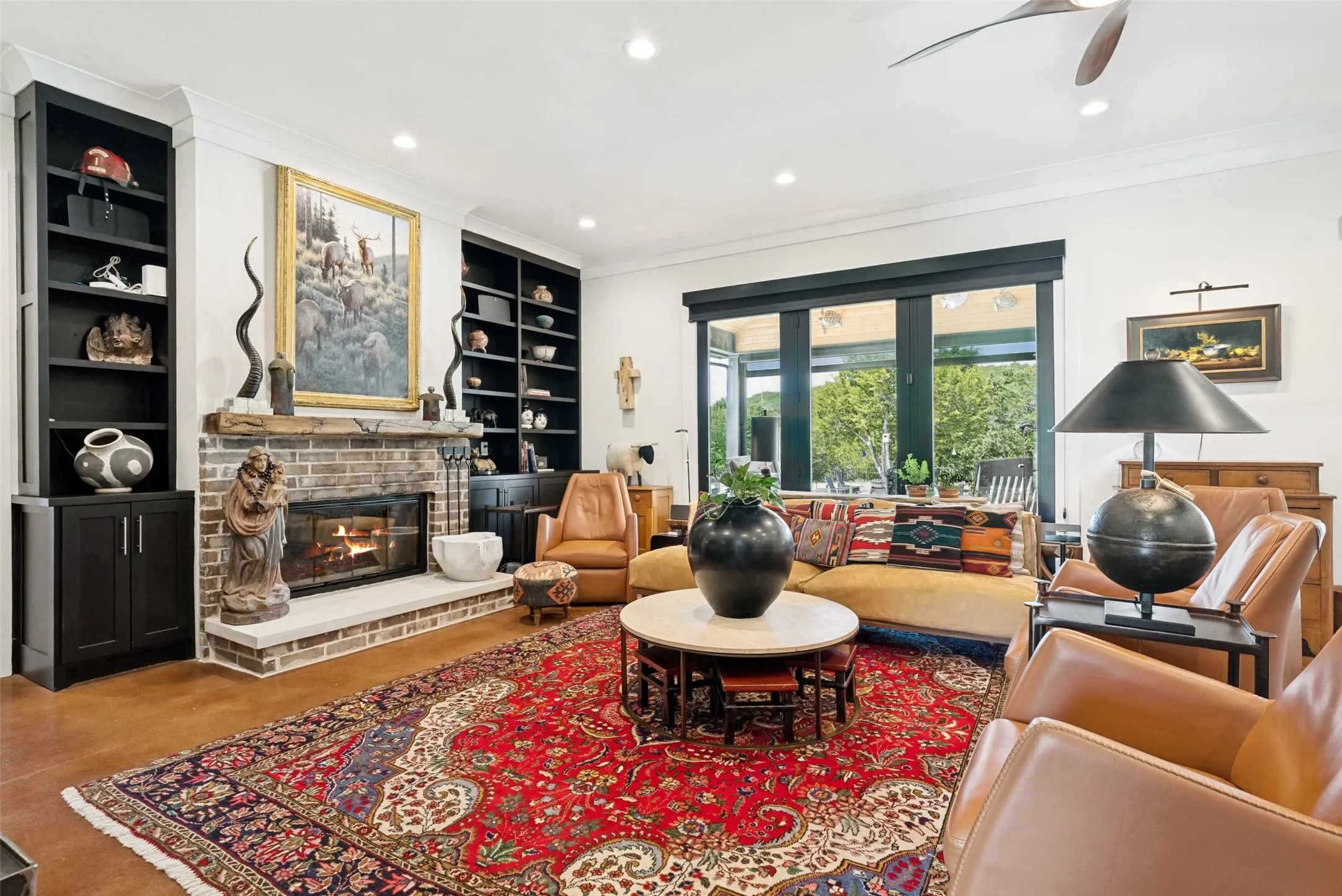 Wood buring fireplace, built-n cabinetry floor to ceiling window