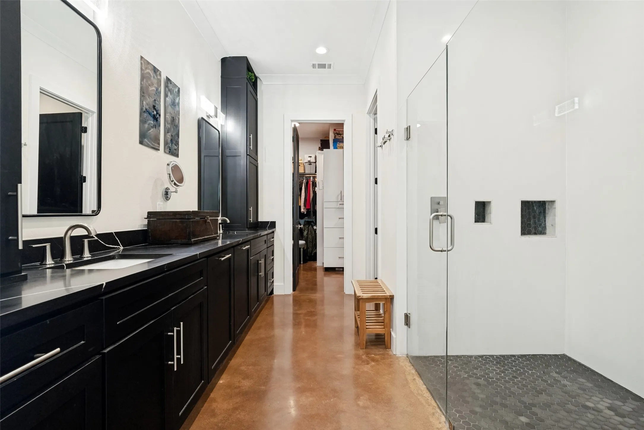 Upper cabinetry on each end, huge shower, seperate water closet with more built in cabinetry