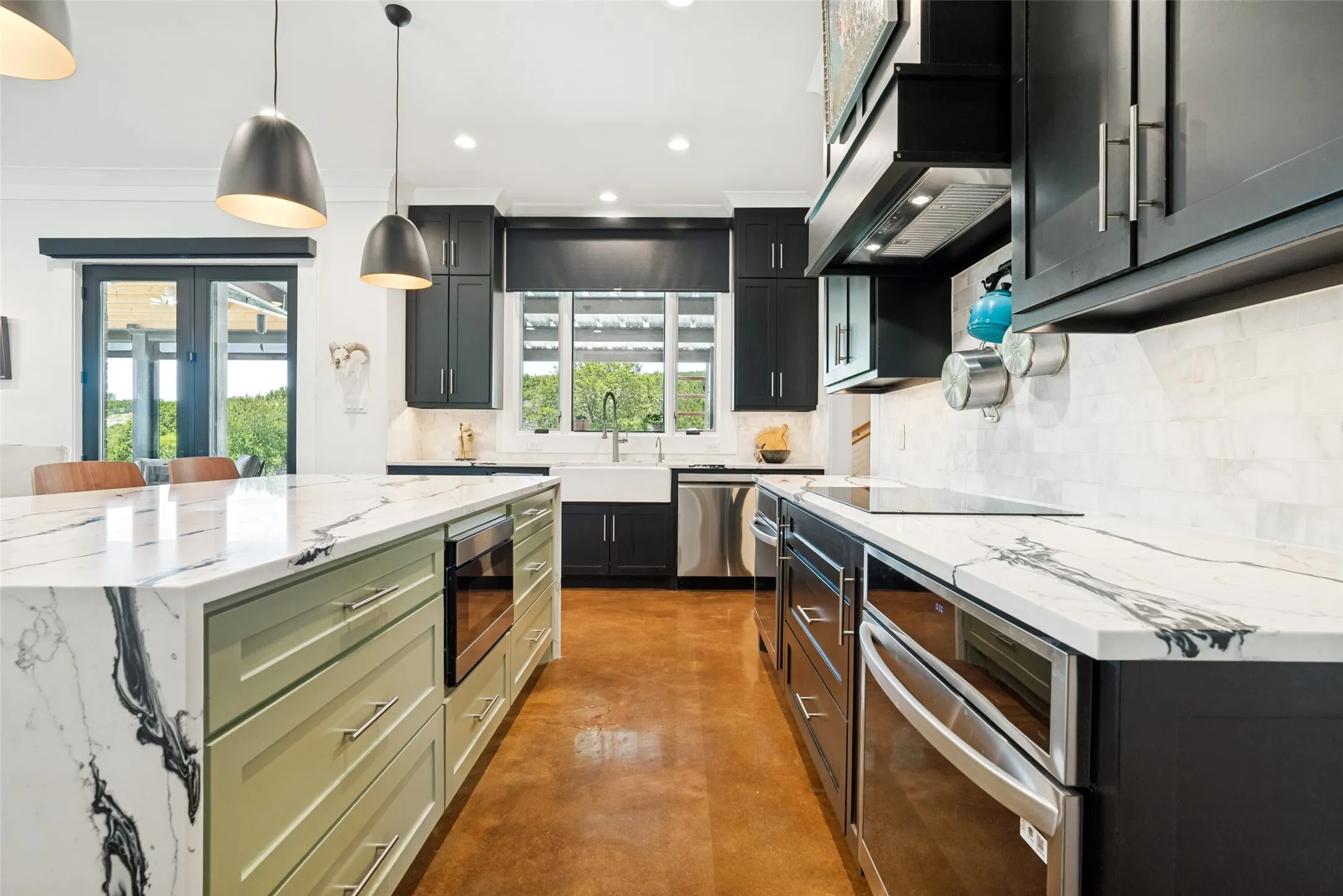 Deep drawers, windows over sink, induction cooktop, right oven, vented hood