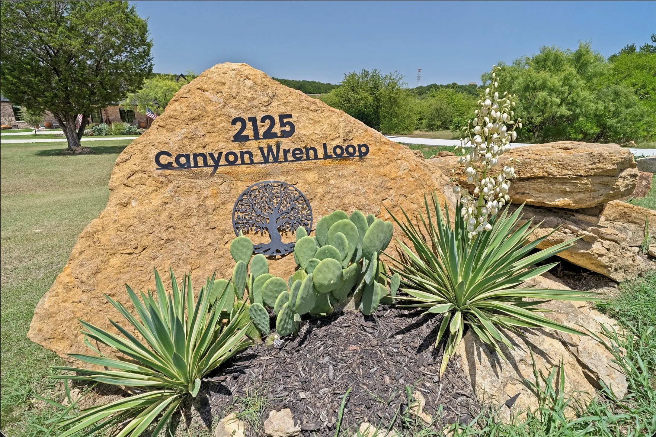 Entrance marker with plantings