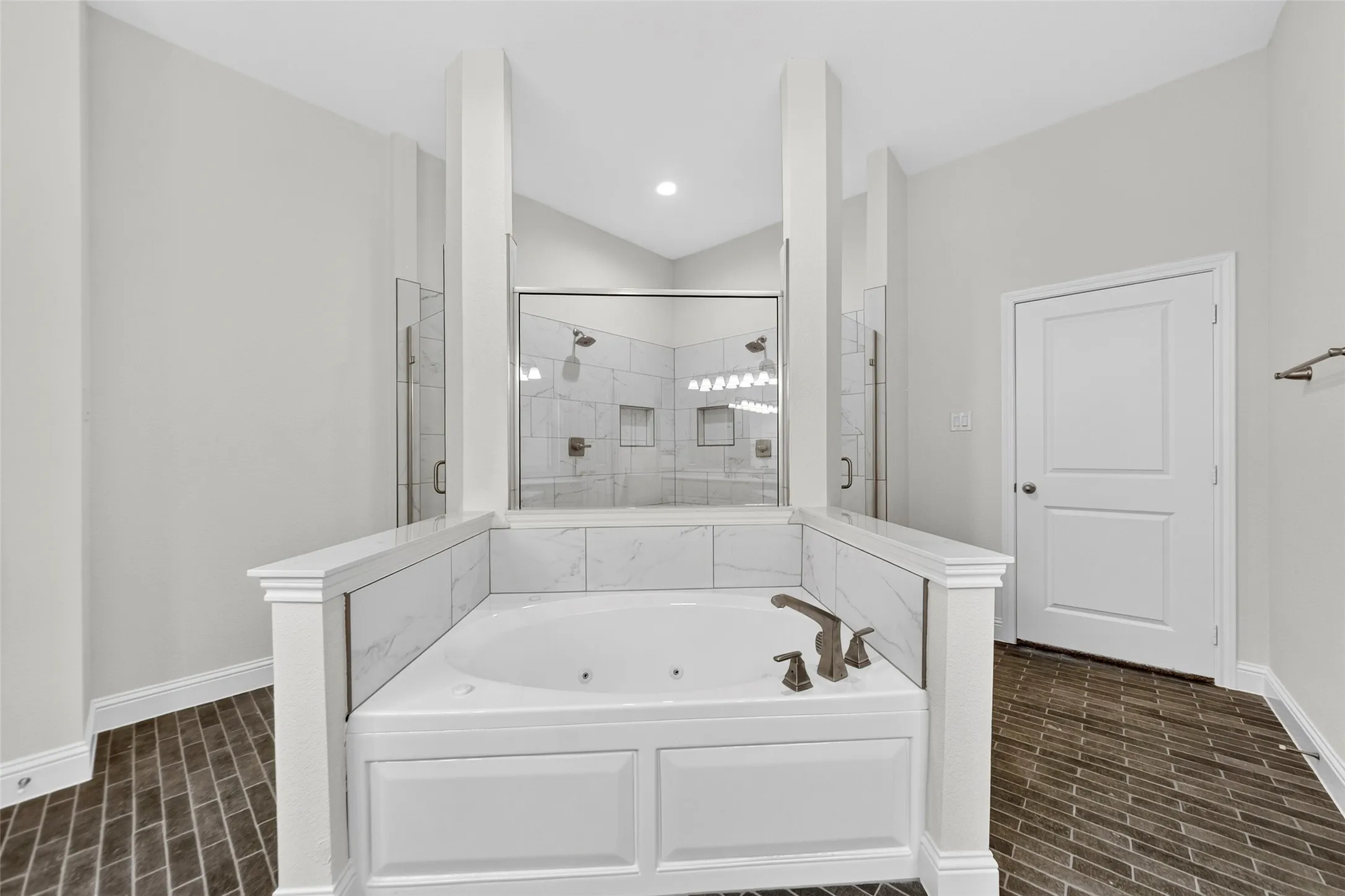 Soaking tub with bronze finish fixtures