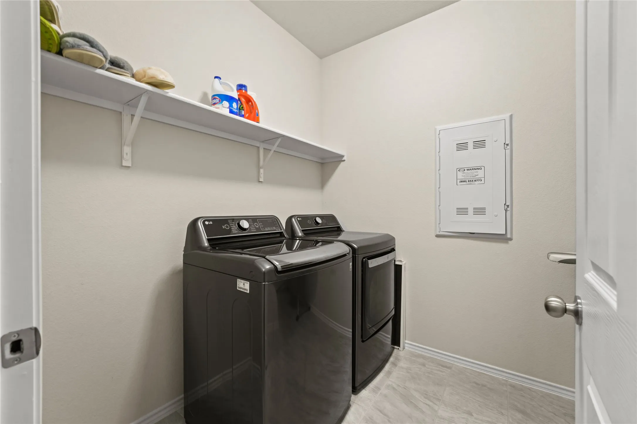 Laundry room featuring washer and clothes dryer