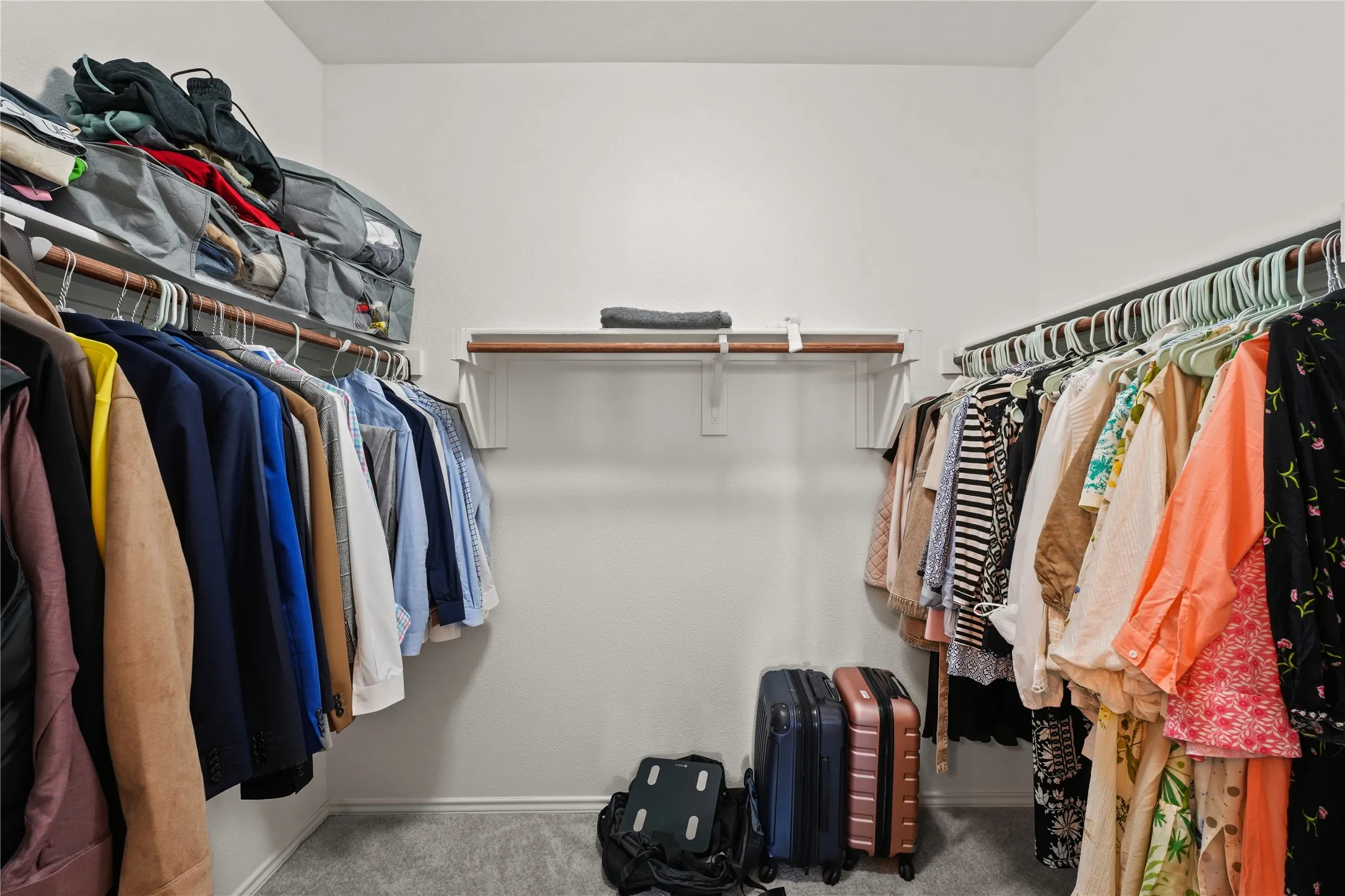 Spacious closet with carpet floors